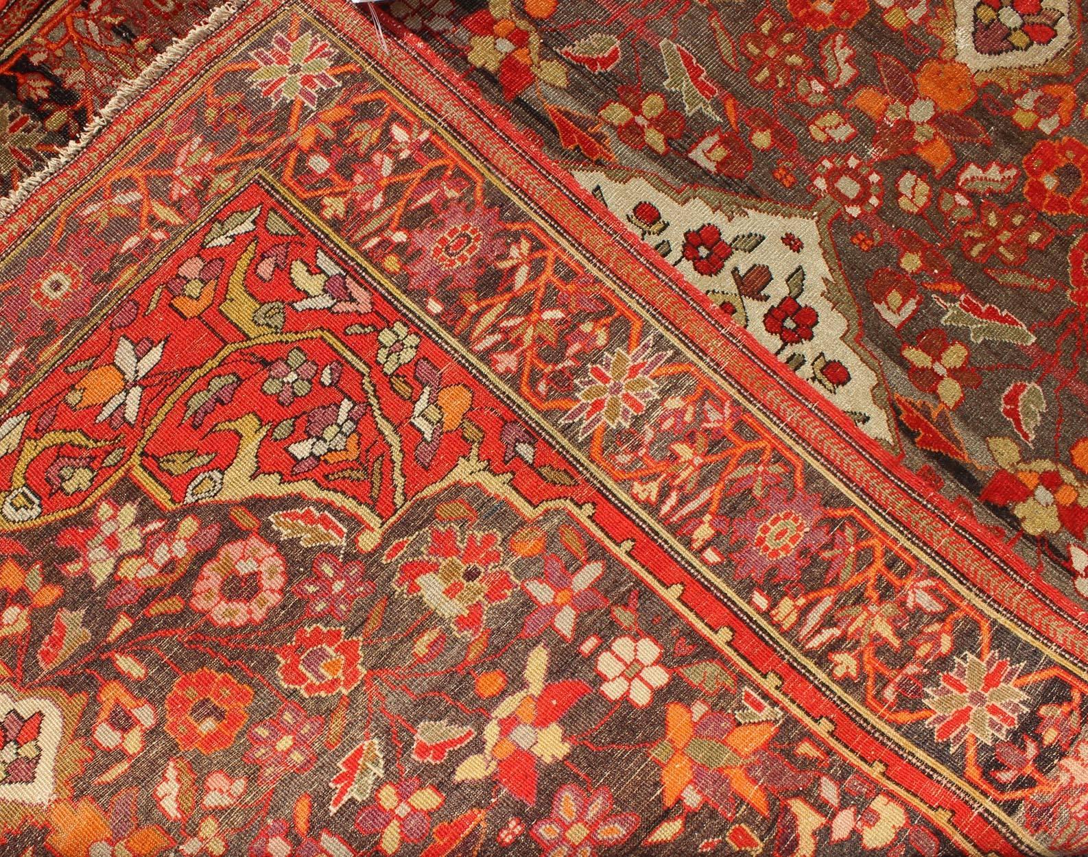 Early 20th Century Sarouk Farahan Rug with Florals and Vine Scrolls in Red, Ivory, Taupe and Orange For Sale
