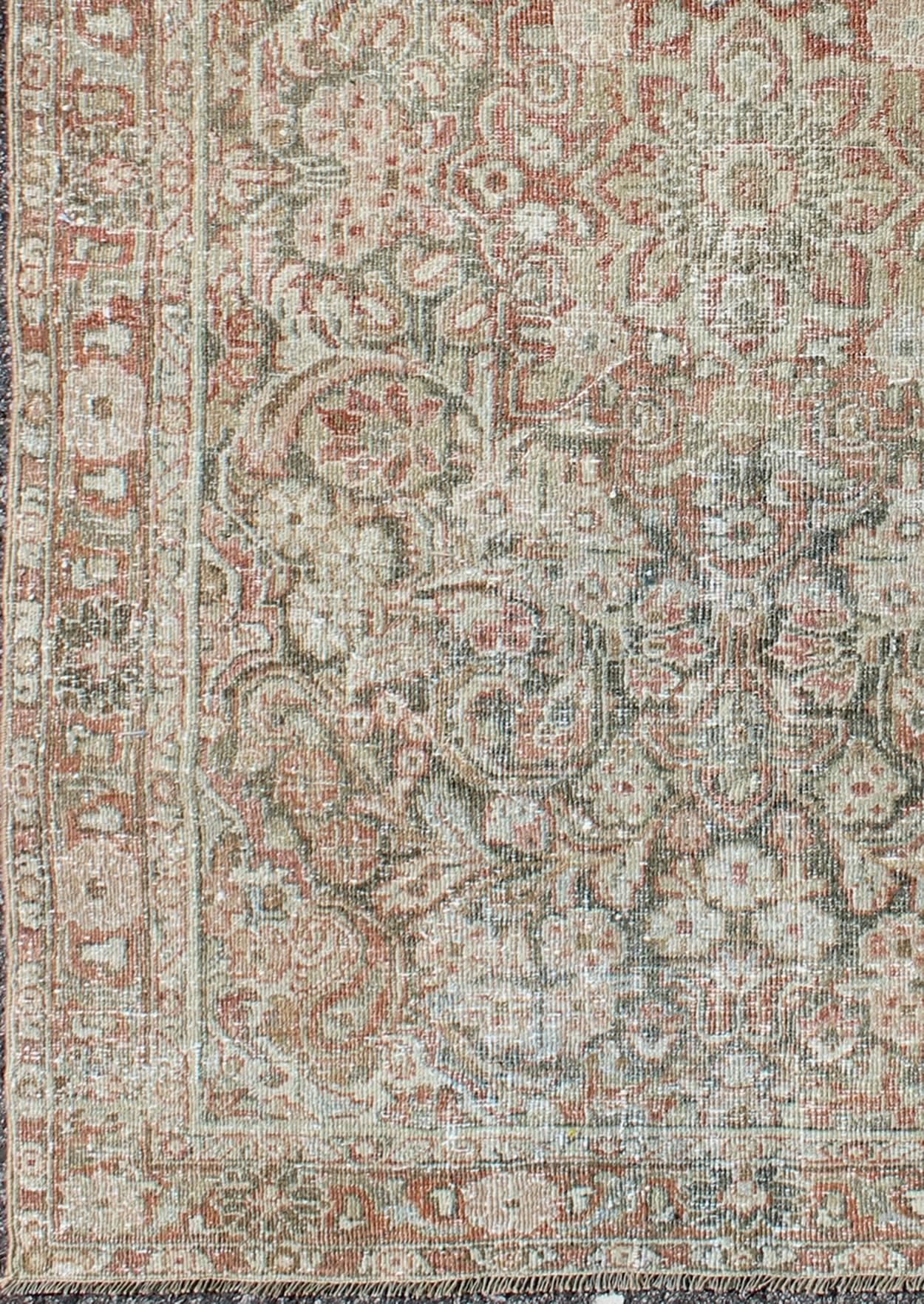 This Mahal relies heavily on exquisite details as well as large-scale flowers and palmettes. A fine trellis of beautifully colored large and small flowers sprawls across the faint green field, pulsating with alternating rhythms in contrasting ivory