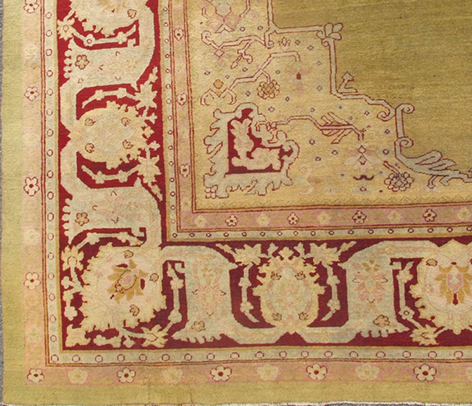 Large Antique Green Background Indian Amritsar Carpet with Red Border. Keivan Woven Arts / rug / 13-0706 / 1920 circa Early 20th Century. / Antique Amritsar, Antique Agra.
Measures: 13'2 x 18'0.
This carpet was woven in Amritsar in the late 19th
