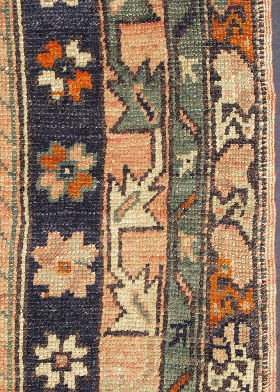 20th Century Vintage Turkish Oushak Rug with Multiple Defining Borders of Geometric Florals