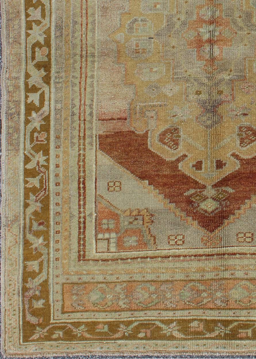  Vintage Turkish Oushak with Large Central Medallion in Cream, Yellow, Brown and Red. Keivan Woven Arts/ rug/TU-UGU-136095, origin/turkey  

Measures: 3'7 x 5'8.   

This vintage Oushak rug features an intricately beautiful design. The central