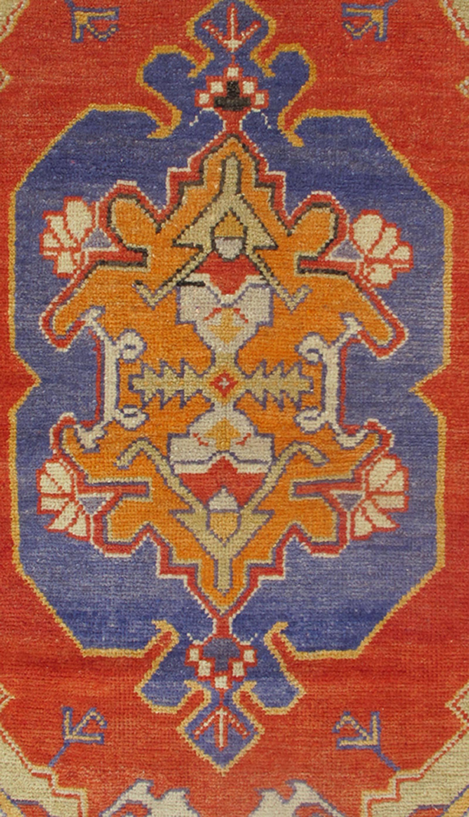 20th Century Colorful Vintage Turkish Oushak Rug with Stylized Geometric, Tribal Motifs For Sale