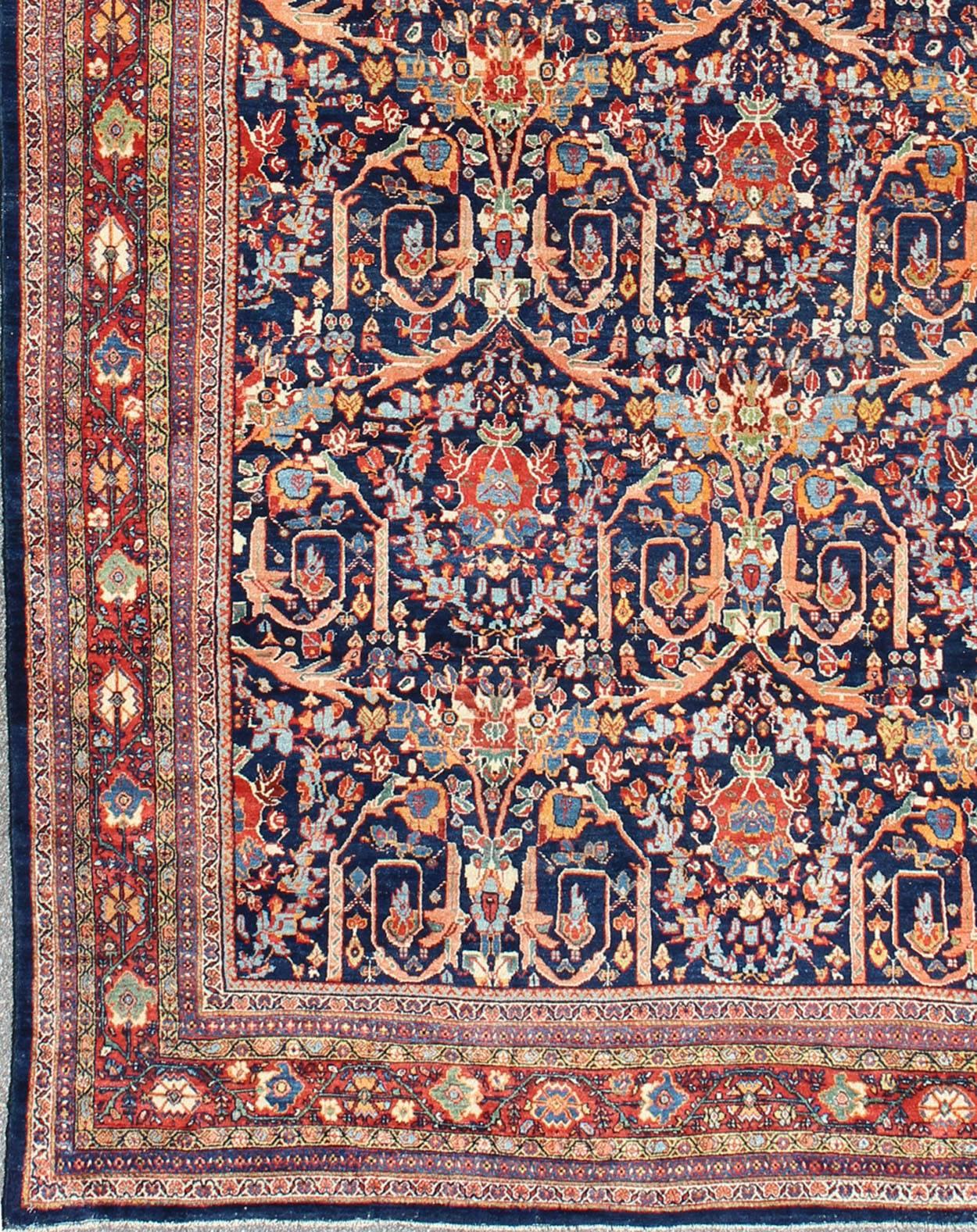 Large Antique Persian Sultanabad Rug in Blue Background and variety of beautiful Colors. rug 17-0105, country of origin / type: Iran / Sultanabad, circa 1910. 

Measures: 13'7 x 20'9.

Set of navy background, this colorful antique Persian large