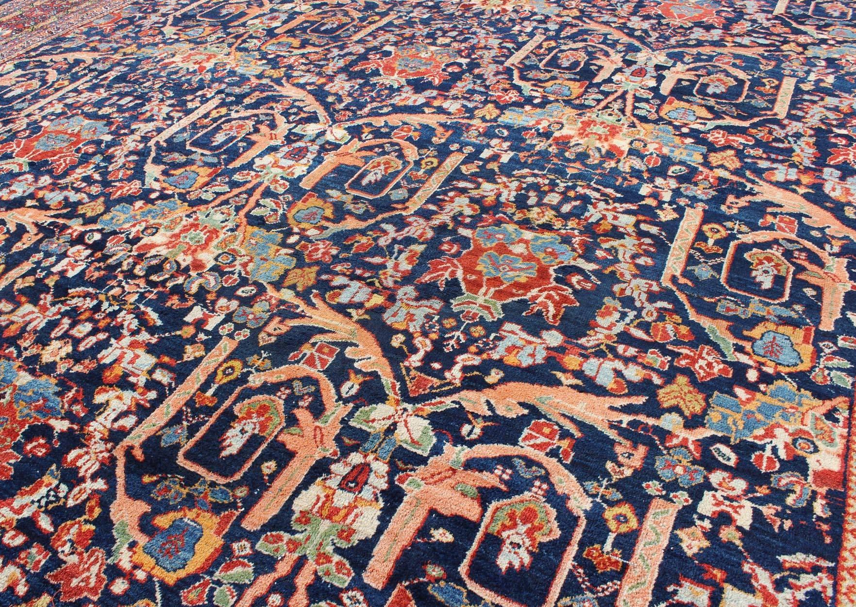 Wool Large Antique Persian Sultanabad Rug in Blue Background & Multi Colors For Sale