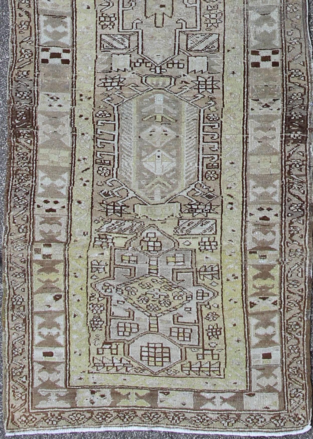 Long Antique Heriz Runner, rug /CA-2440, country of origin / type: Persia / Heriz, circa 1930.
This magnificent antique long Heriz runner from the early 20th Century bears an exquisite design rendered in gorgeous hues of taupe, gray, and olive.
