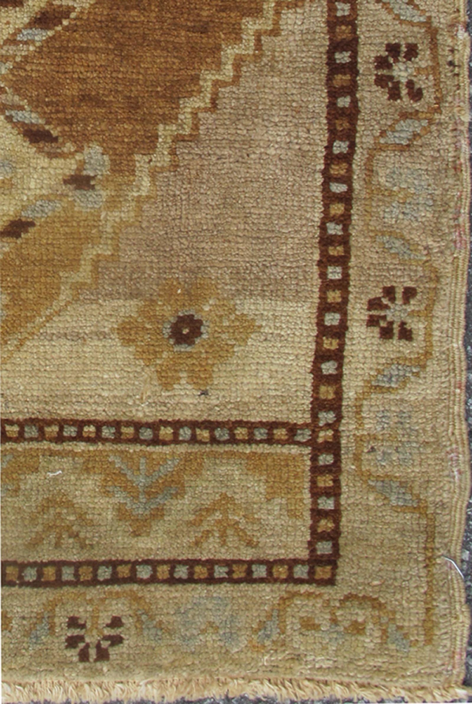 Small Turkish Oushak Carpet with Central Medallion in Light Brown, En-219, 1940's Vintage Small Turkish Oushak Rug. This Turkish Oushak carpet features a central medallion design, as well as smaller botanical elements. The rug's qualities are