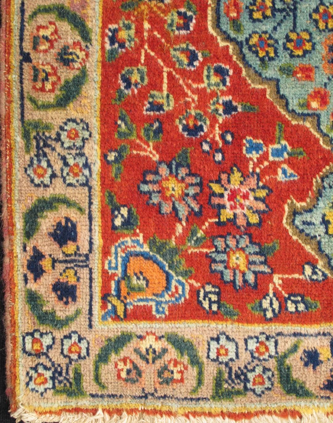 This spectacular Persian Tabriz bears magnificent splendor indicative of royal tastes, which sought perfection in balance and palette. The circular, script-style medallion displays various floral motifs and is complemented by two stretched palmettes