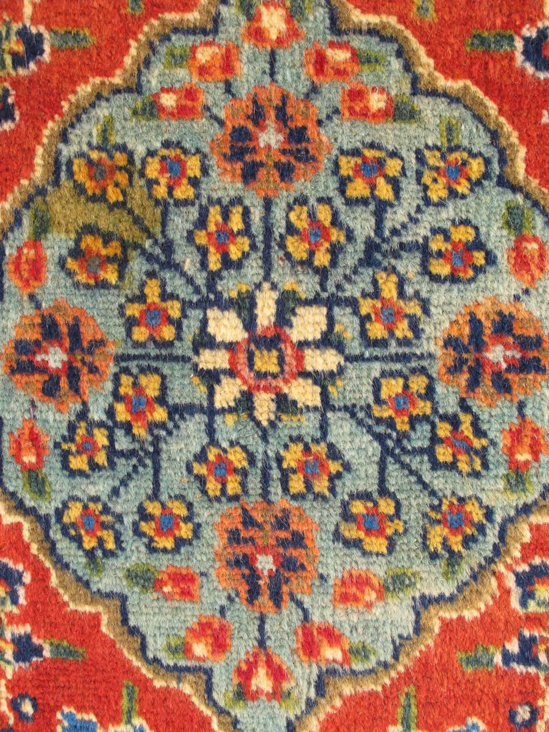 Persian Colorful Antique Tabriz Rug with Circular Medallion, Palmettes and Floral Motifs For Sale