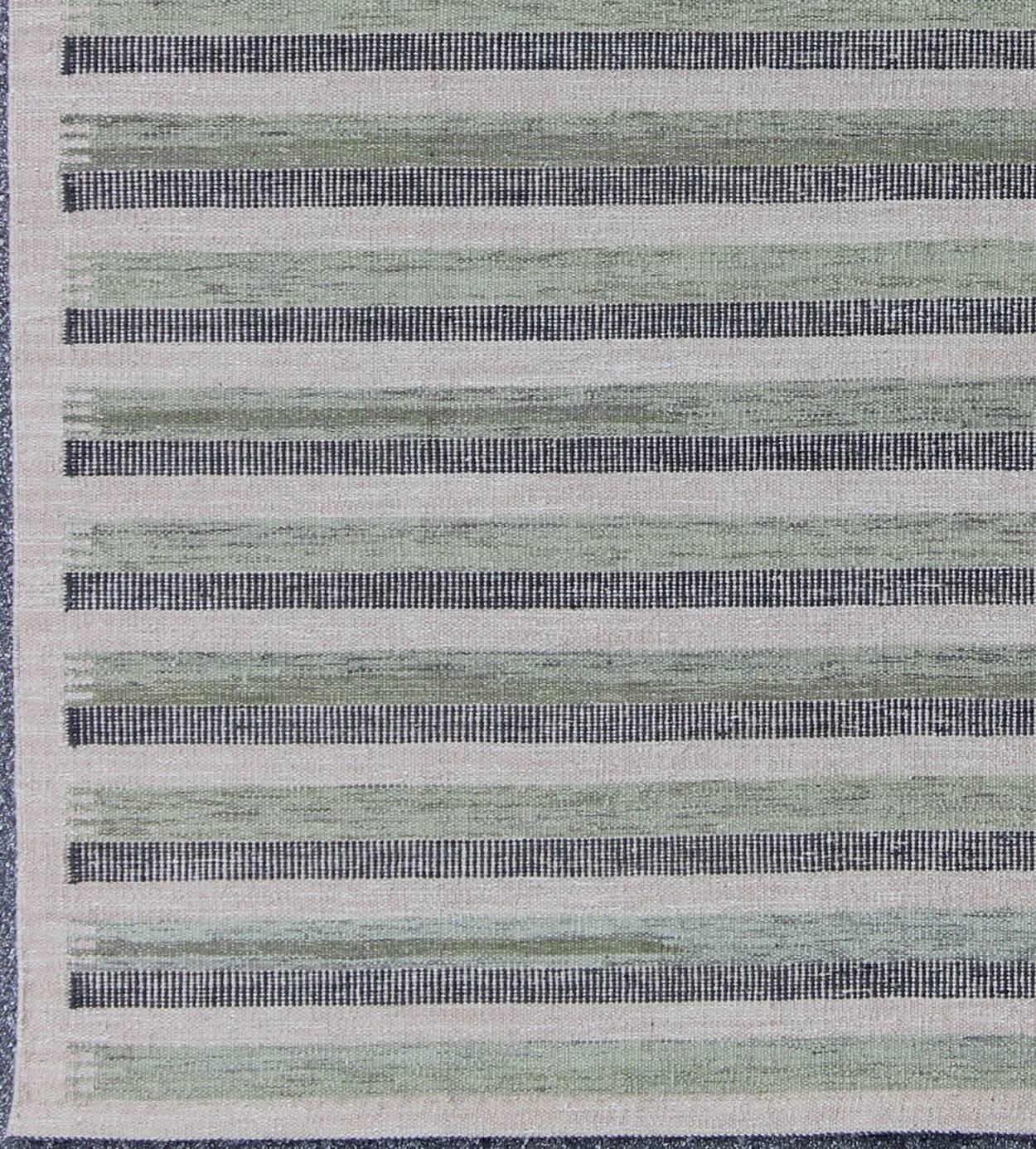 This modern Scandinavian flat-weave patterned rug is inspired by the work of Swedish textile designers of the early to mid-20th century. With a unique blend of historical and modern design, this dynamic and exciting composition is beautifully suited