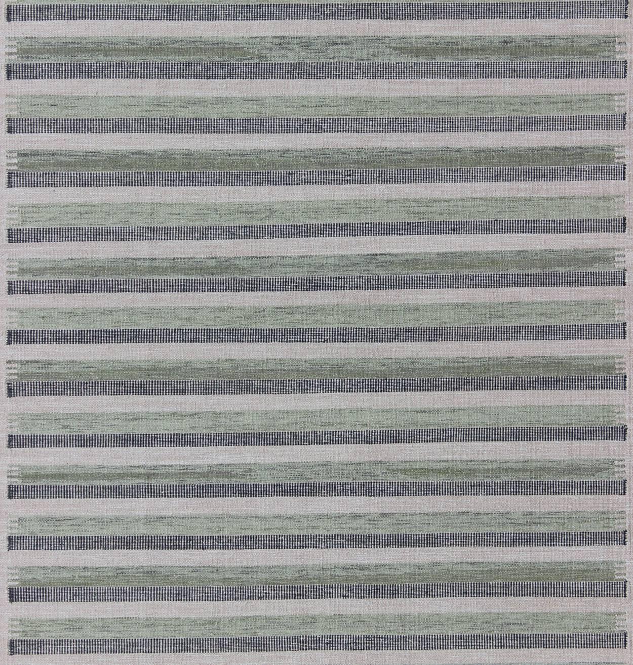 green flat weave rug