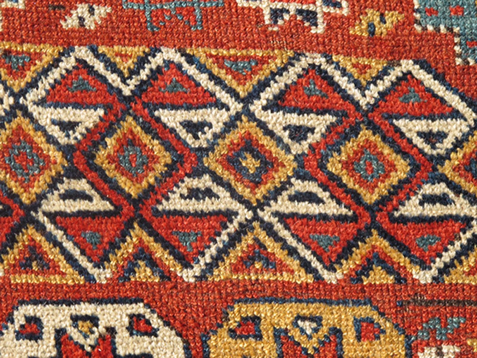 Caucasian Unique Antique Qashqai Rug with Geometric Motifs in Red, Blue, and Golden Yellow For Sale