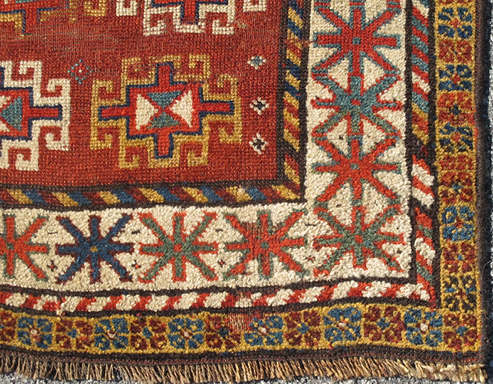 Unique Antique Qashqai Rug with Geometric Motifs in Red, Blue, and Golden Yellow, Rug #S12-0518.  This stunning 19th century Qashqai rug from the central region of Persia displays three magnificent, geometric central medallions and an all-over