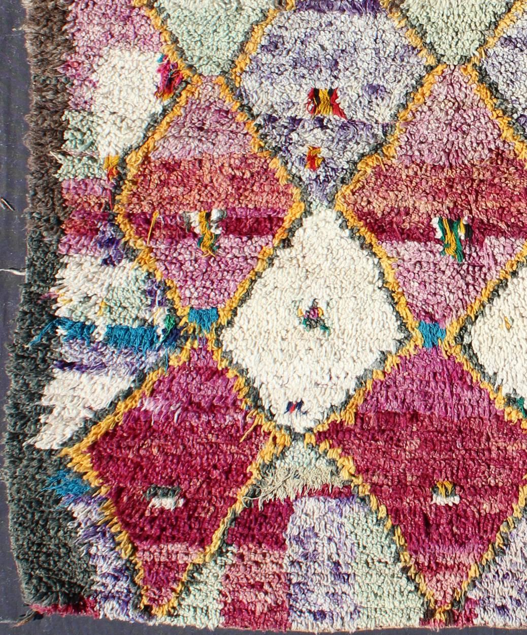 Colorful vintage Moroccan rug with pink, yellow, turquoise, ivory, gray diamonds, rug bds-136636, country of origin type: Moroccan, circa mid-20th century

This graphic handwoven, tribal-style Berber rug features an all-over design of