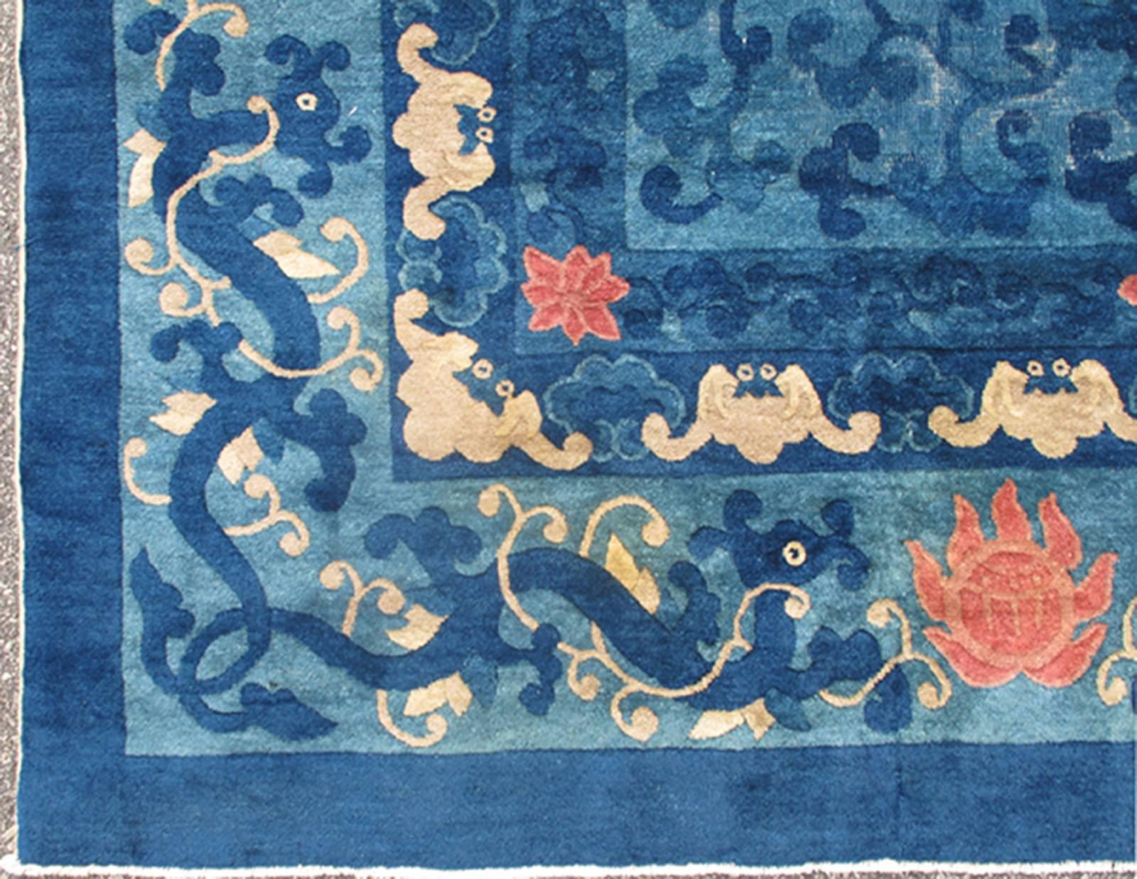 Blue antique Chinese Peking rug with all-over floral pattern, 19th century antique Peking rug l11-0804, country of origin / type: China / Art Deco, circa 1910.

Alive with color and exotic patterns, this beautiful antique Peking Chinese rug