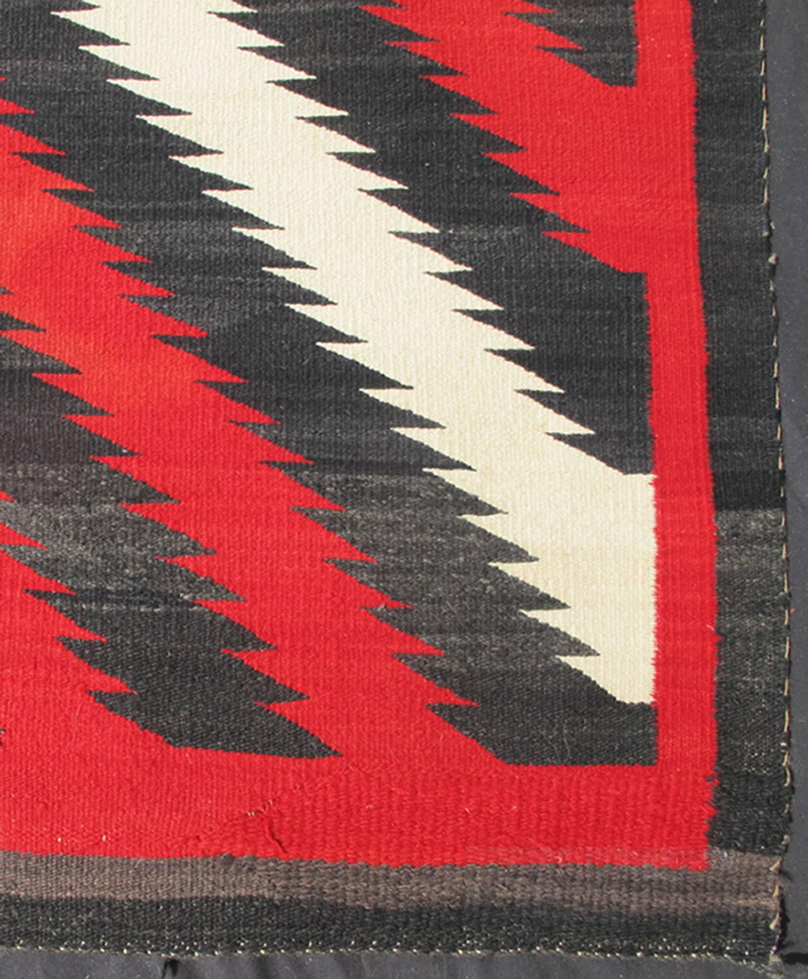 1920s American antique Navajo rug with geometric design in red, white and black, rug s12-0603, country of origin / type: America / Navajo, circa 1920

This intriguing antique Navajo rug, (circa 1920) was woven in the United States during the first