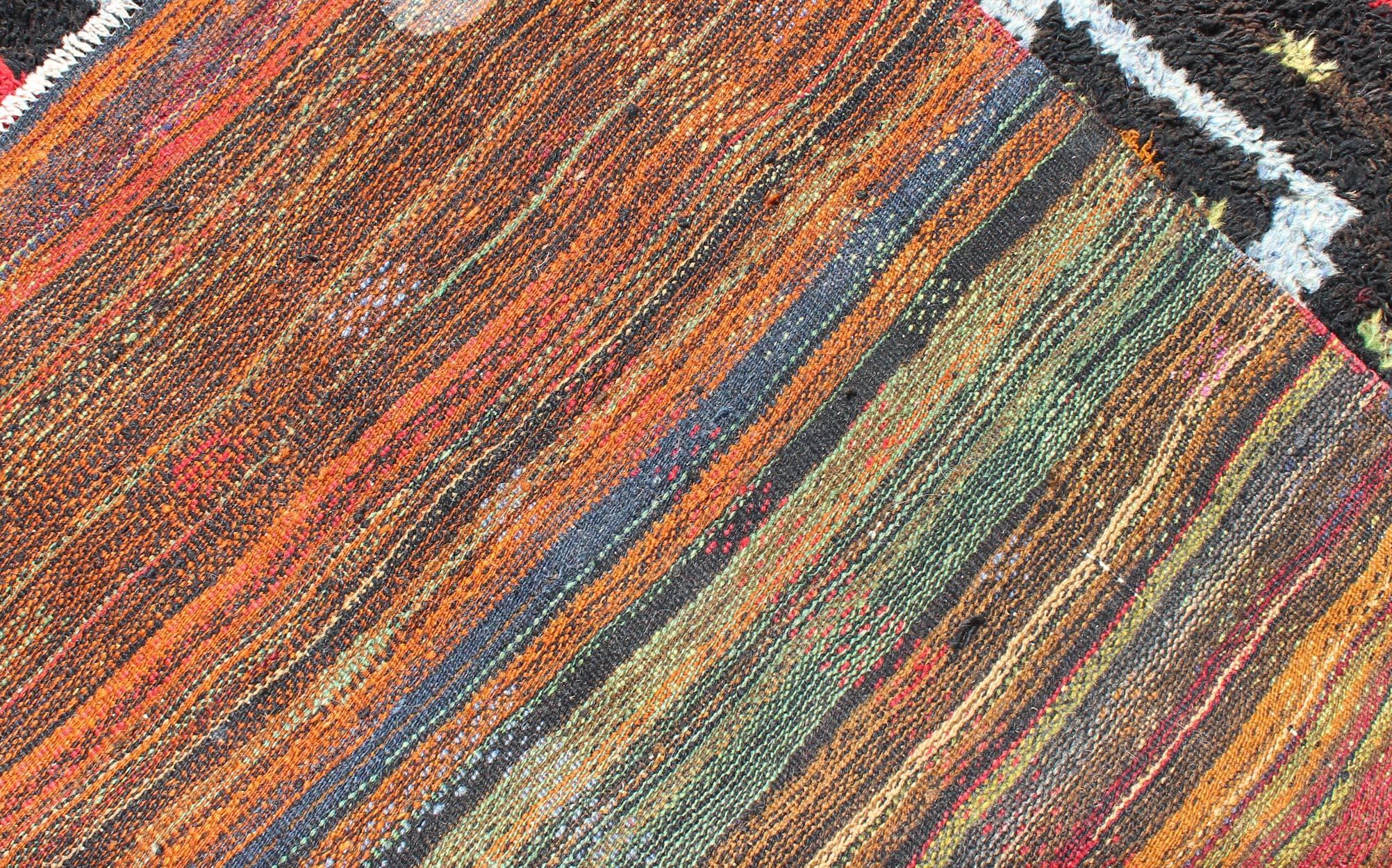 Wool Vintage Turkish Tulu Rug with Tribal Pattern in Black, Yellow, Red, Blue and Red For Sale