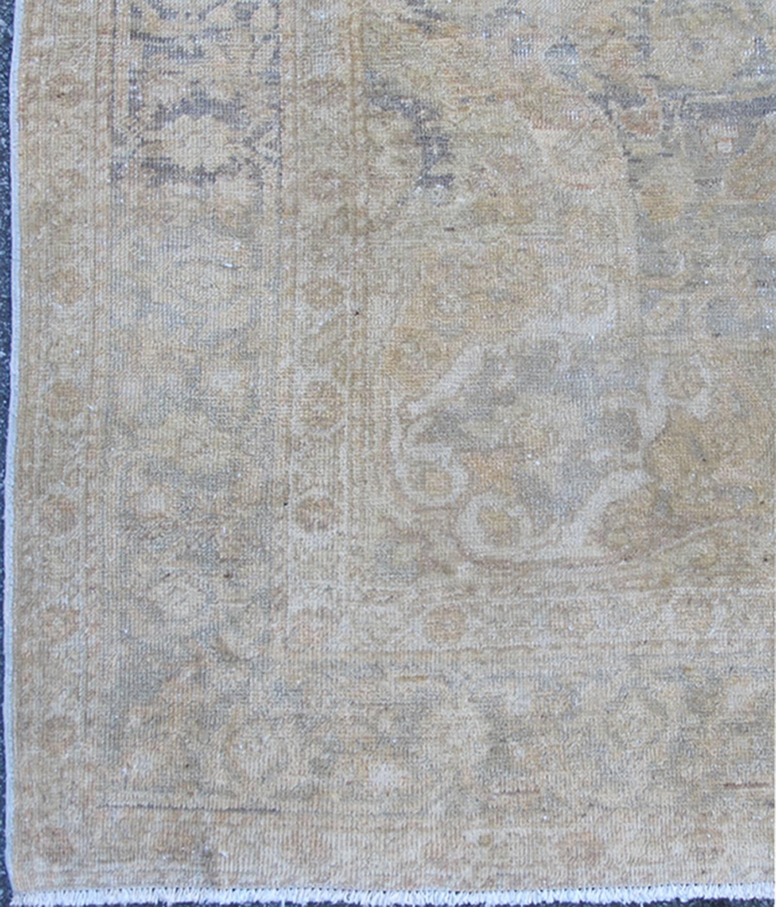 Gray faded vintage Turkish Sivas rug with floral motifs and medallion, rug en-777, country of origin / type: Turkey / Oushak, circa mid-20th century.

Fine Sivas rugs from western Anatolia are renowned for their fine weaves and intricate designs.