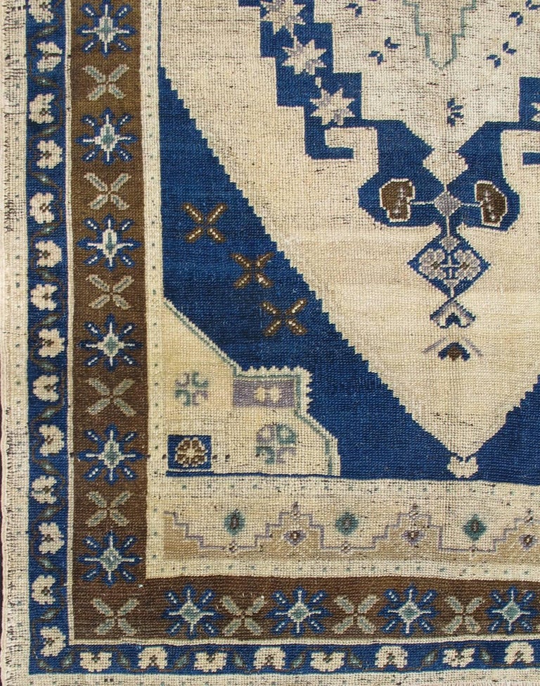Vintage Turkish Oushak Rug with Floral Motifs in Navy Blue, Ivory and