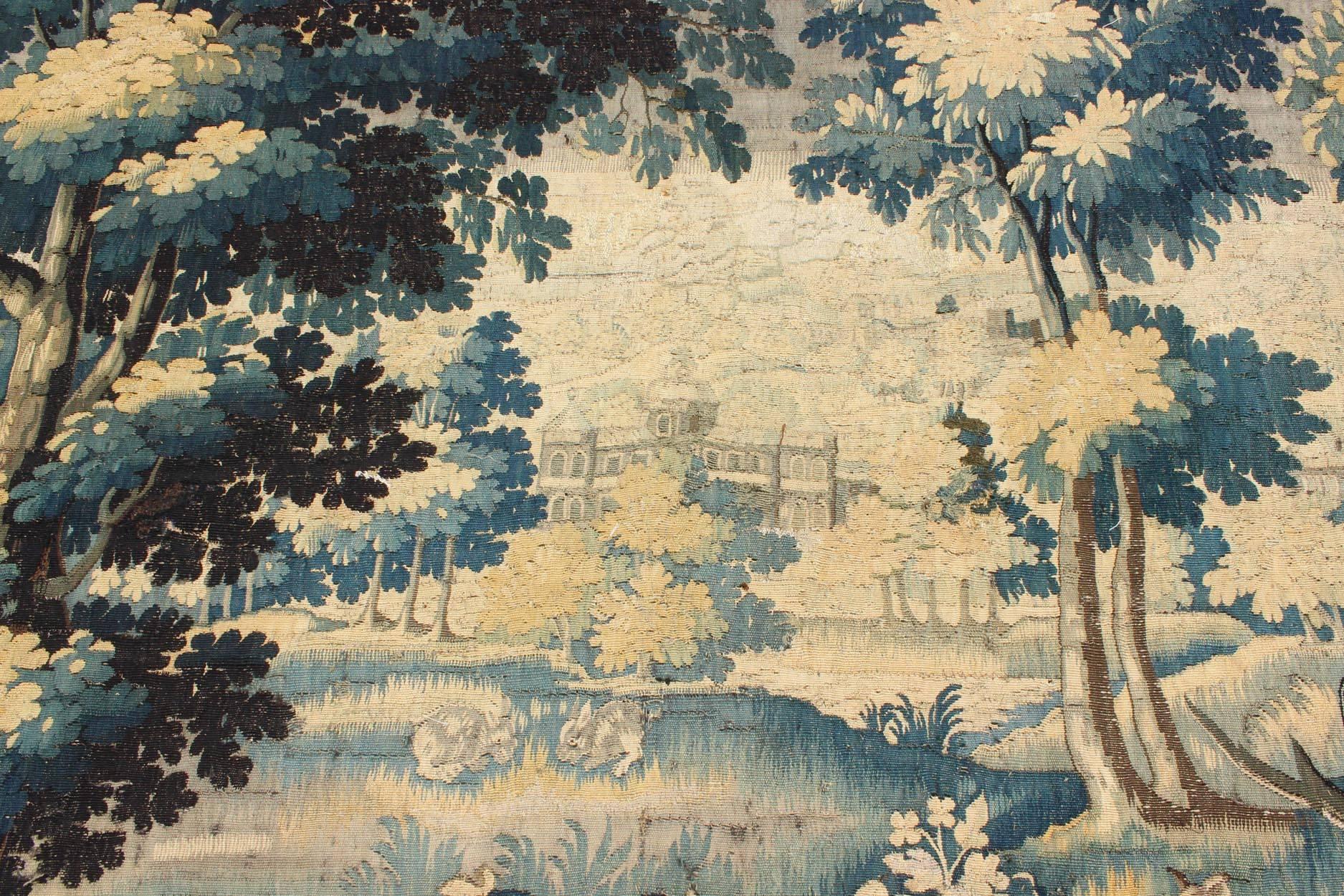 Hand-Knotted 17th Century Antique Tapestry with Woodland Scene and Floral Border in Blue Tone For Sale