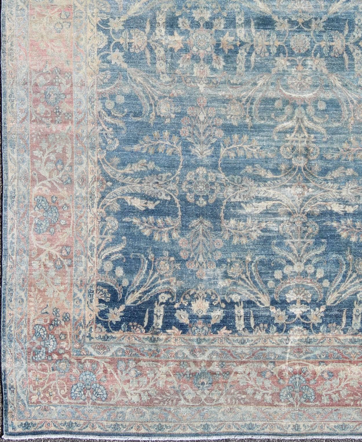 Antique Hand Knotted Persian Kerman rug with Paisley and floral motifs on blue field, Keivan Woven Arts / rug 16-1003, country of origin / type: Iran / Kerman, circa 1920

This antique Persian Kerman rug features a blue field, which hosts a