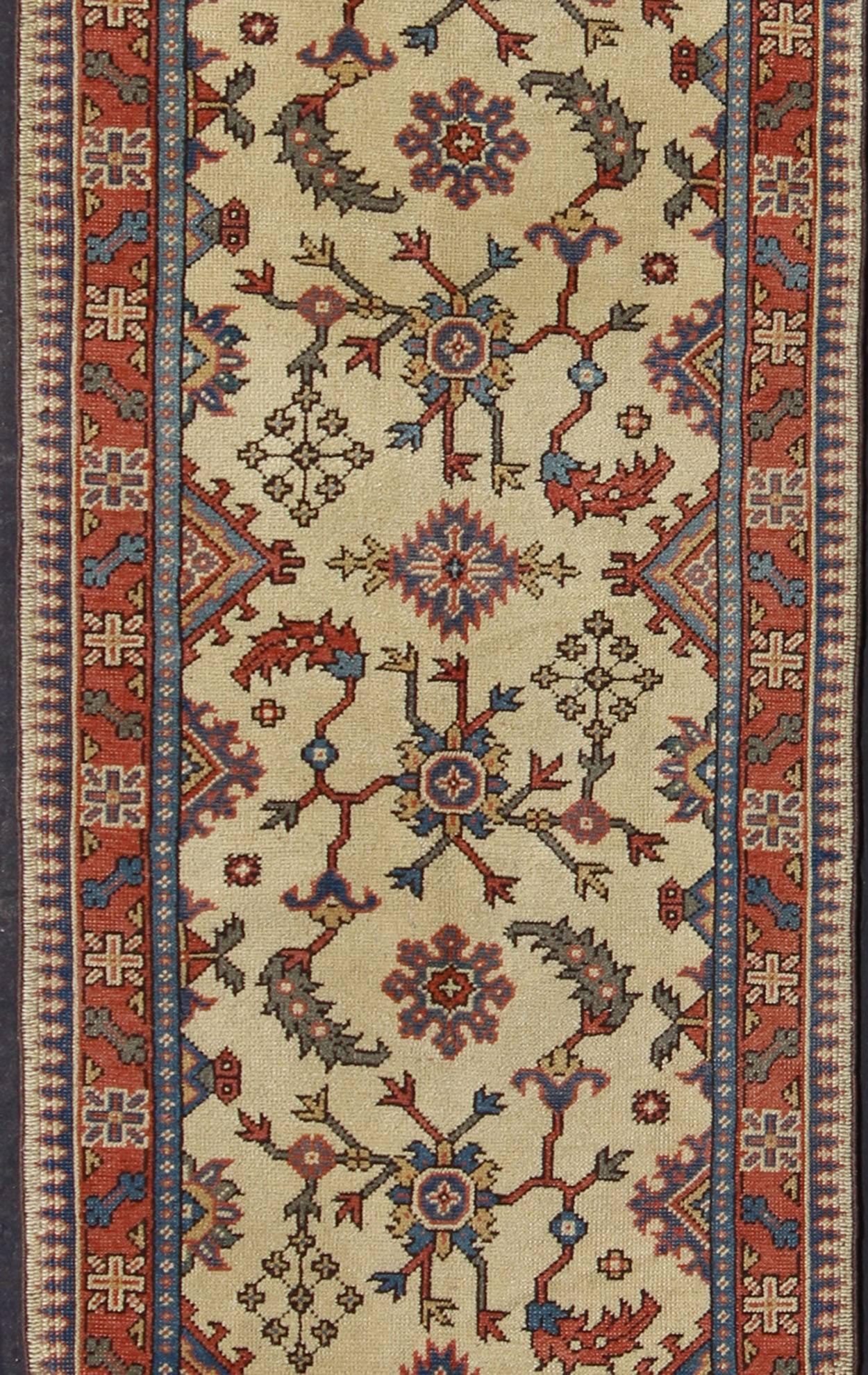 Hand-Knotted Long Turkish Oushak Runner with All-Over Design in Cream, Coral Red and Blue For Sale