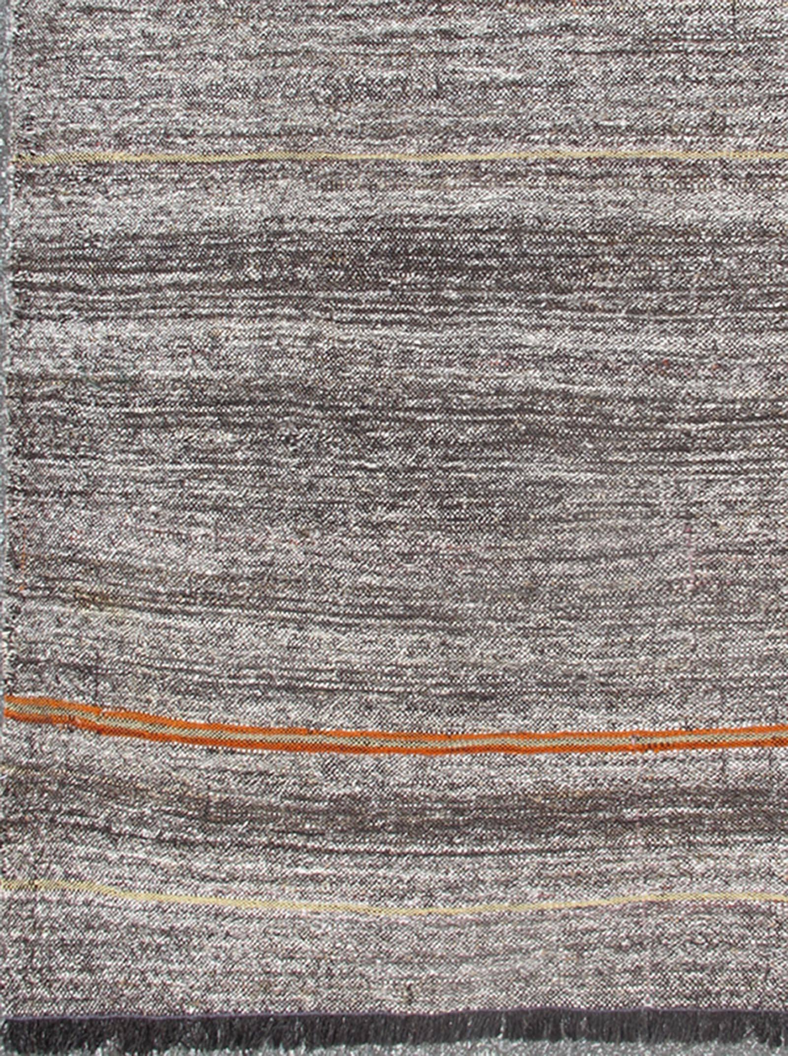Vintage Turkish Kilim rug with variegated stripes in charcoal, gray and orange, Keivan Woven Arts/ rug TU-NED-136025, country of origin / type: Turkey / Kilim, circa mid-20th century

Measures: 6'3 x 9'2.

This vintage tribal Turkish Kilim carpet is