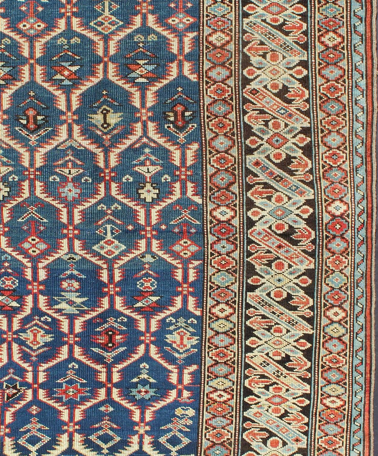 Kazak Amazing Antique Caucasian Chi Chi in Medium Blue Background and Brown Border For Sale