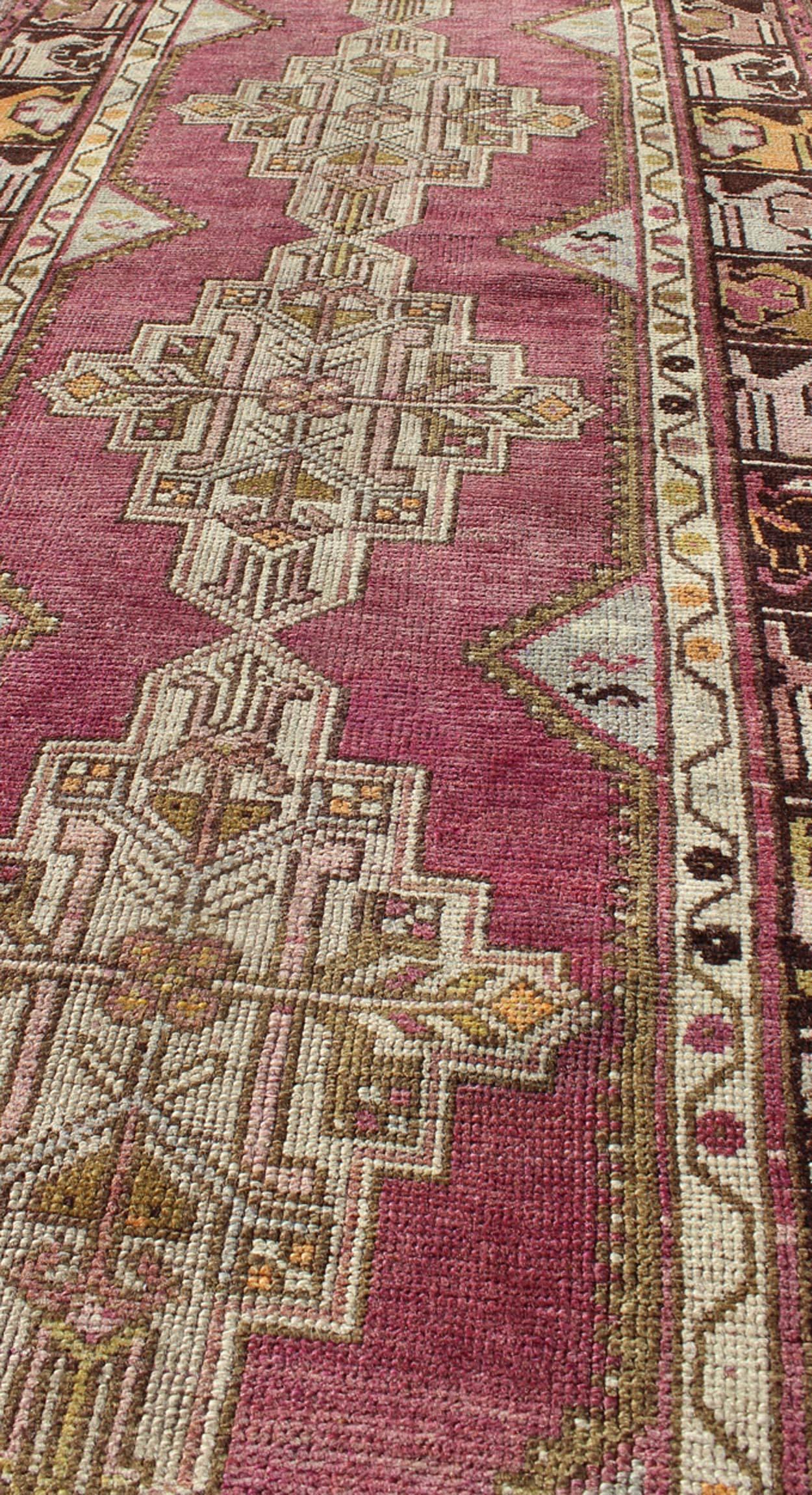 Mid-20th Century Vintage Oushak Runner with Geometric Medallions in Purple and Brown For Sale