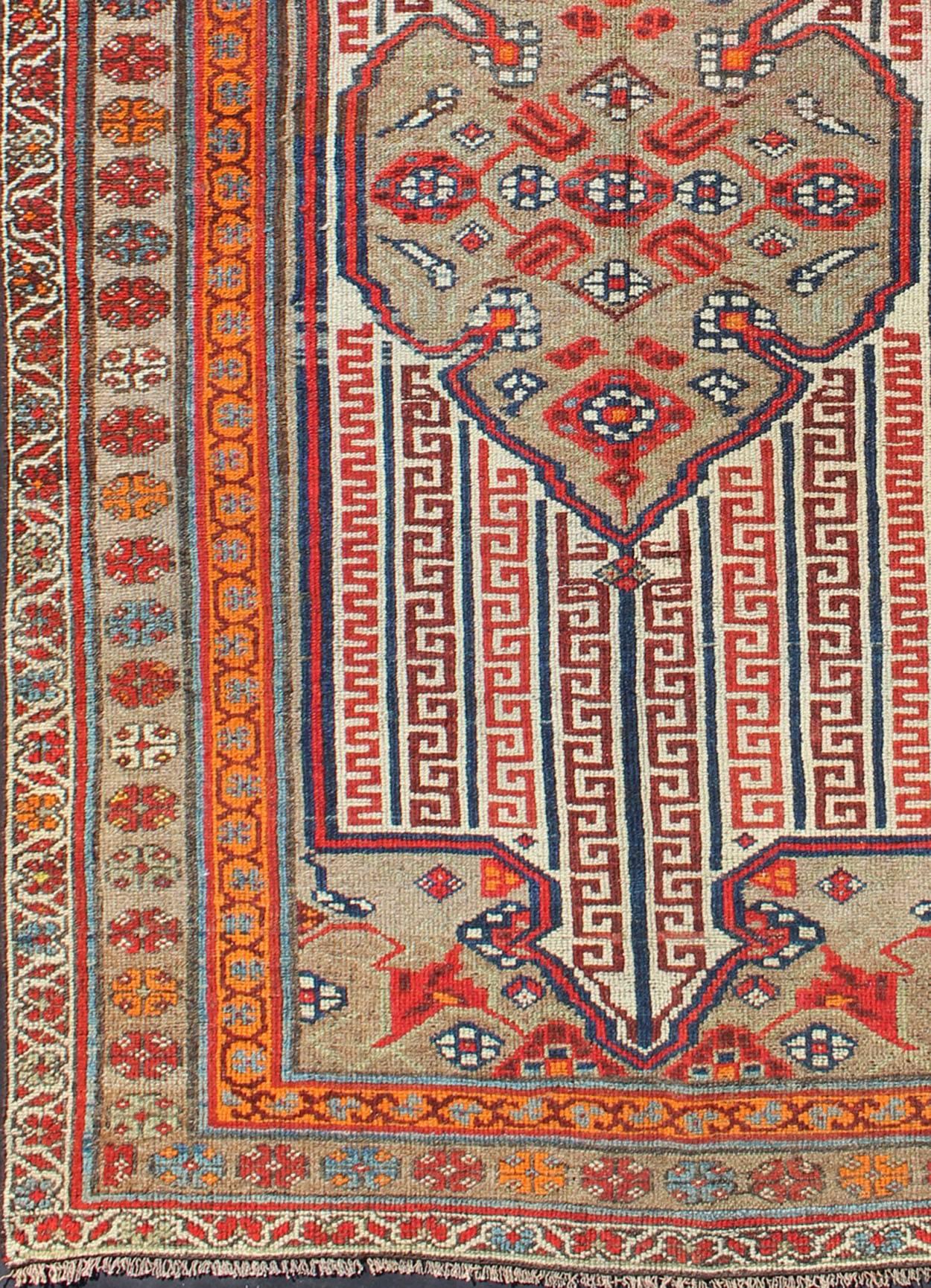 Antique Persian Seneh-Malayer Rug with Intricate Designs and Rich Color Palette.
Fine Seneh-Malayer rugs are known for their complexity of design and opulent color palettes. This particular piece features an intricate combination of motifs and