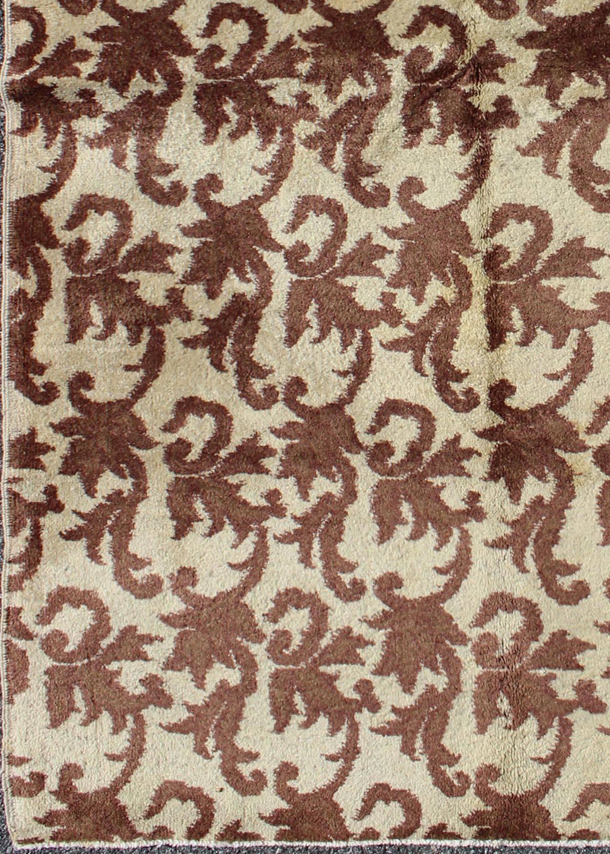 Measures: 3'11 x 6'11.
Rendered in an gray/taupe background with a spotted and speckled assortment of brown color, this unique Art Deco design rug has an all over repeating Design. 

Art Deco design turkish rug with a modern design, rug