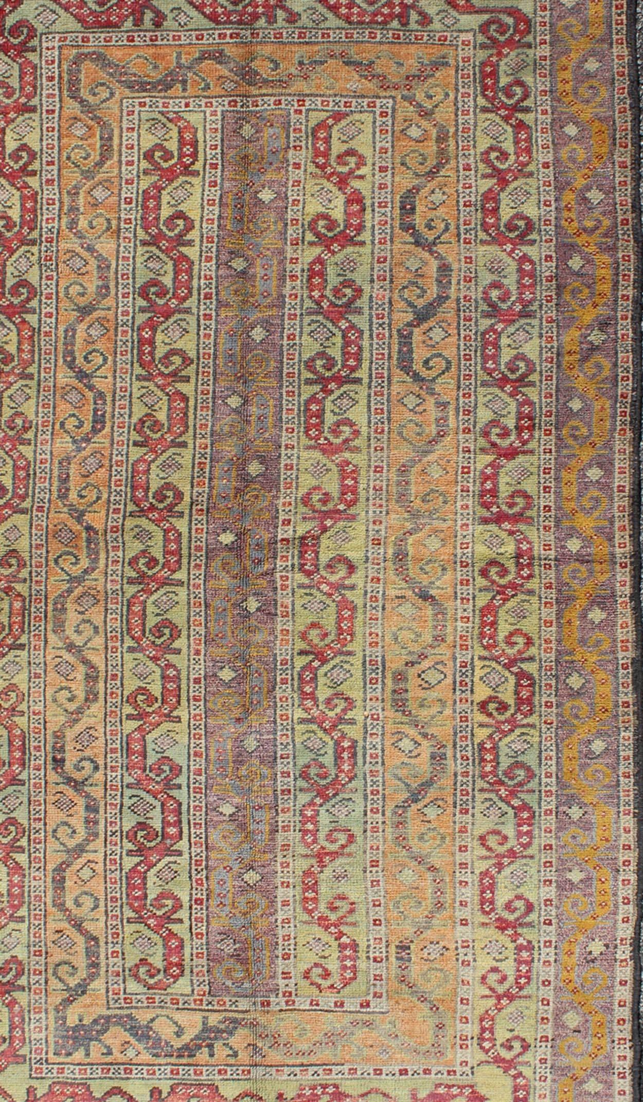 Hand-Knotted Vintage Turkish Rug with a All-Over Modern Design in Green, Red and Purple For Sale