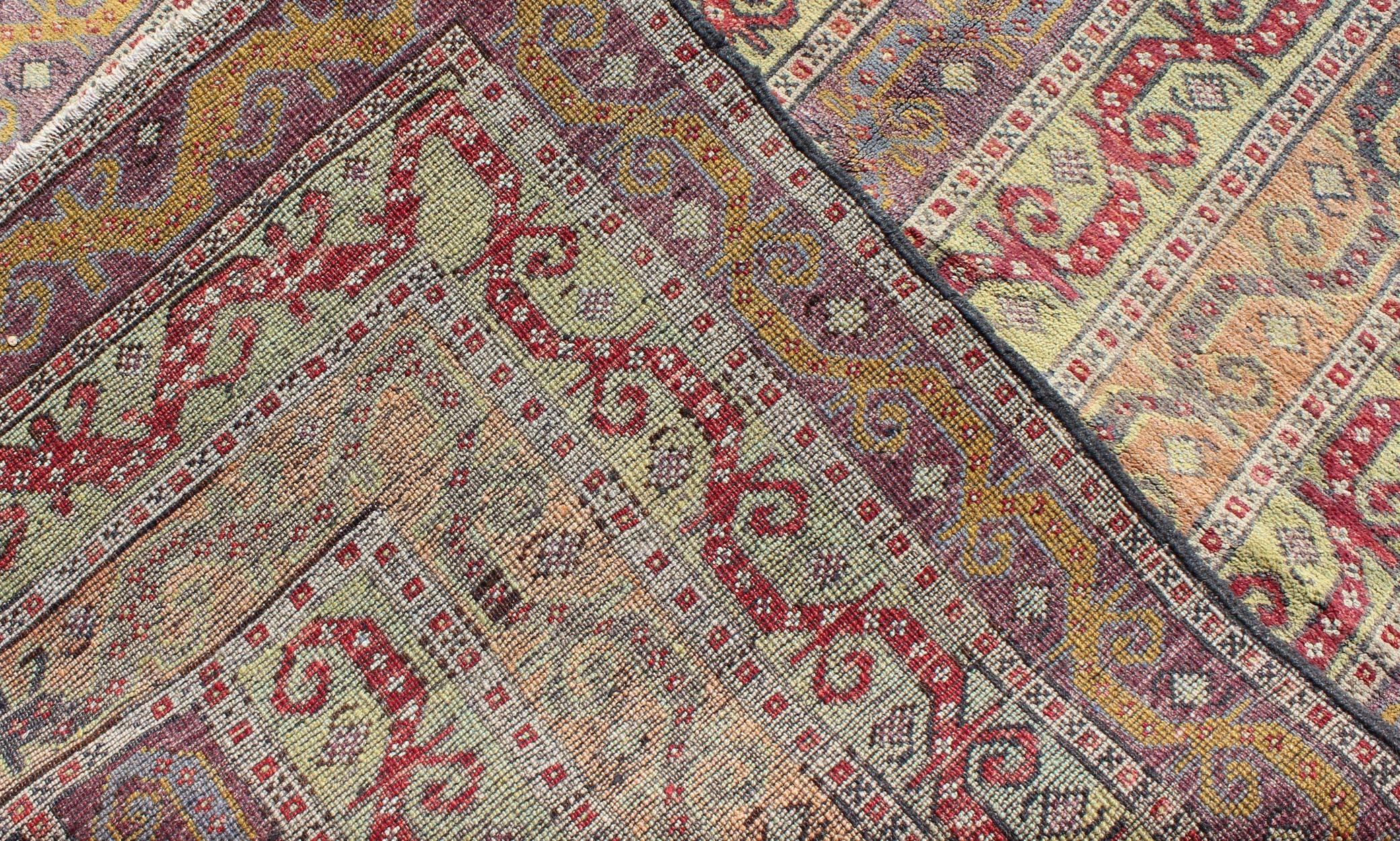 Early 20th Century Vintage Turkish Rug with a All-Over Modern Design in Green, Red and Purple For Sale