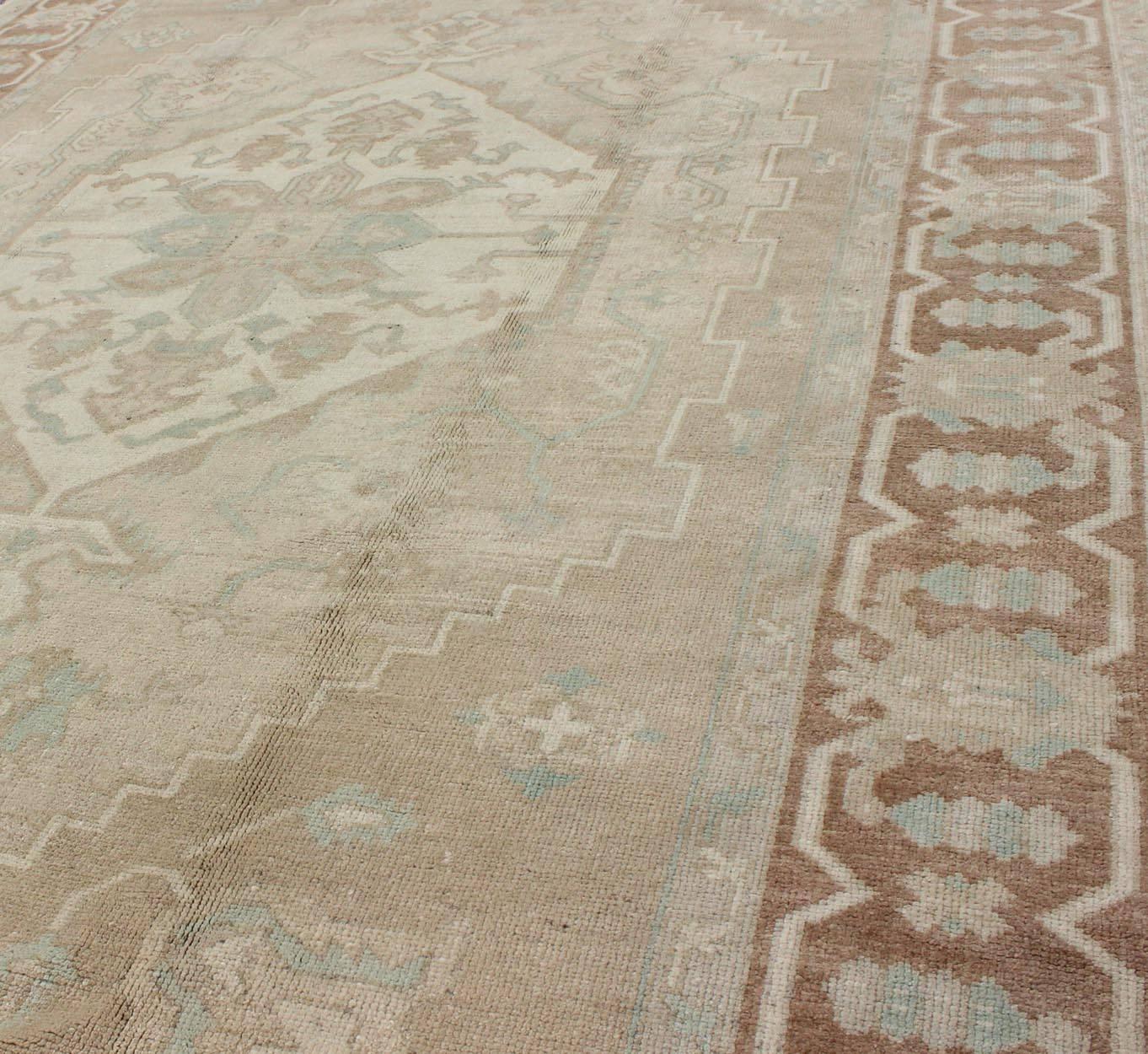 Hand-Knotted Vintage Oushak Medallion Rug With Muted Colors and Earth Tones For Sale