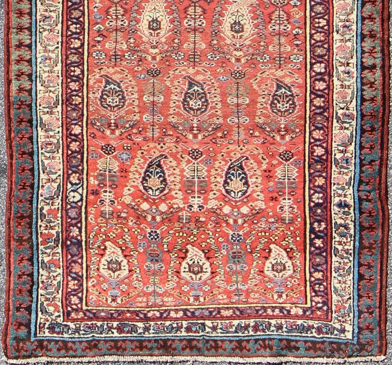 This all-over Persian Serab has a terra cotta background and an ivory border. The elegant design in the field consists of a free-flowing Paisley pattern. The blue, greens and yellows add a hint of color to this stunning runner.
Measures: 3'9 x 10'.