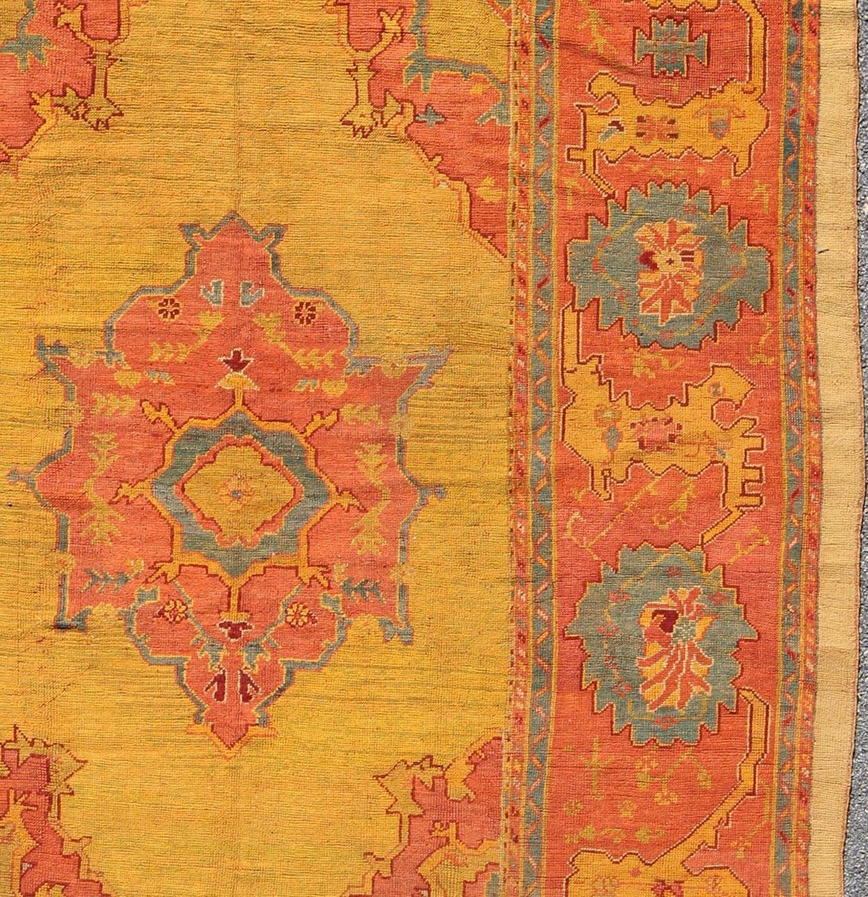 Early 20th Century Antique Turkish Oushak Rug in  Saturated Gold, Orange Colors and Blue Accent 