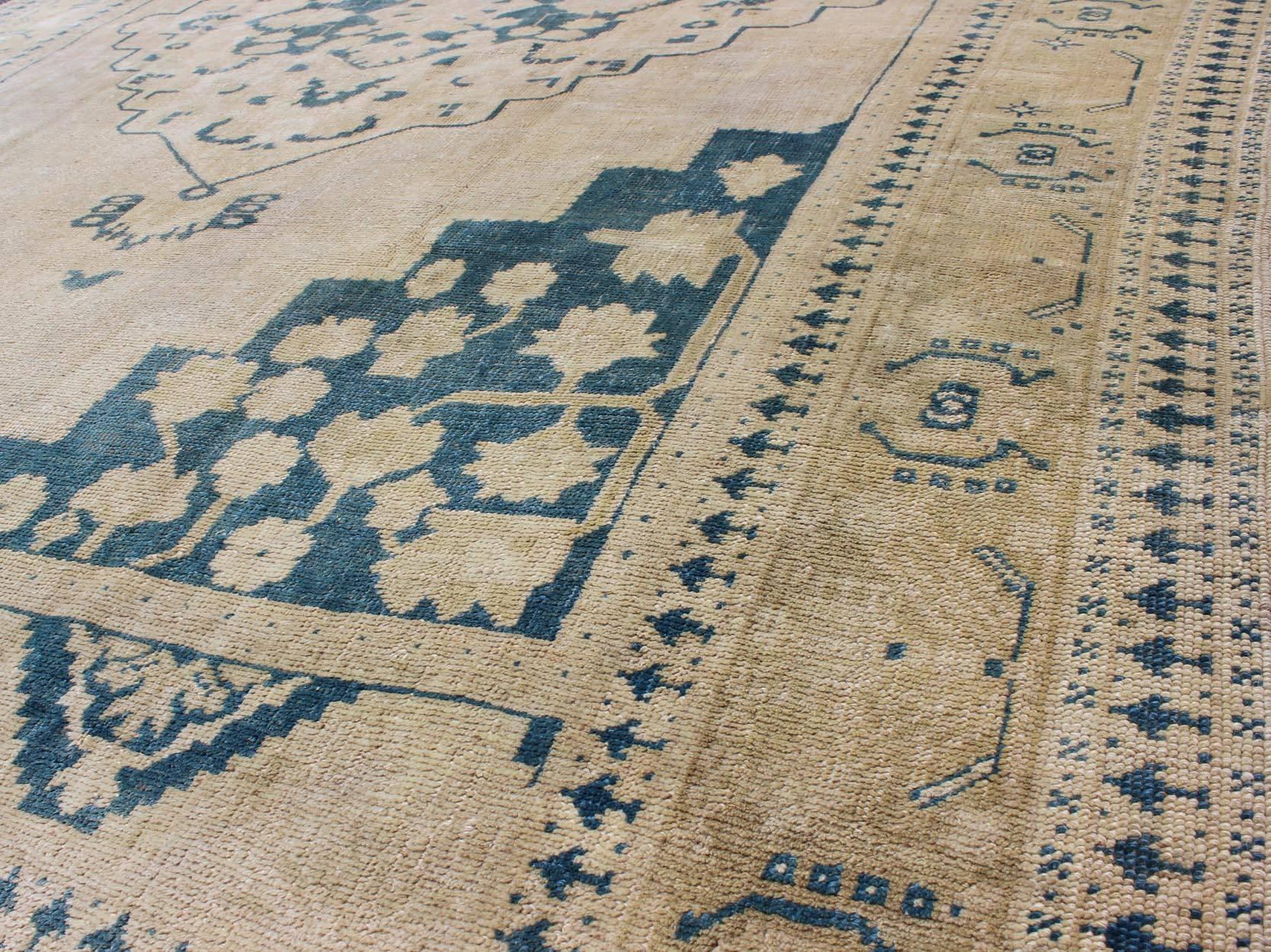 Mid-20th Century Vintage Turkish Oushak Rug in Blue and Cream colors For Sale