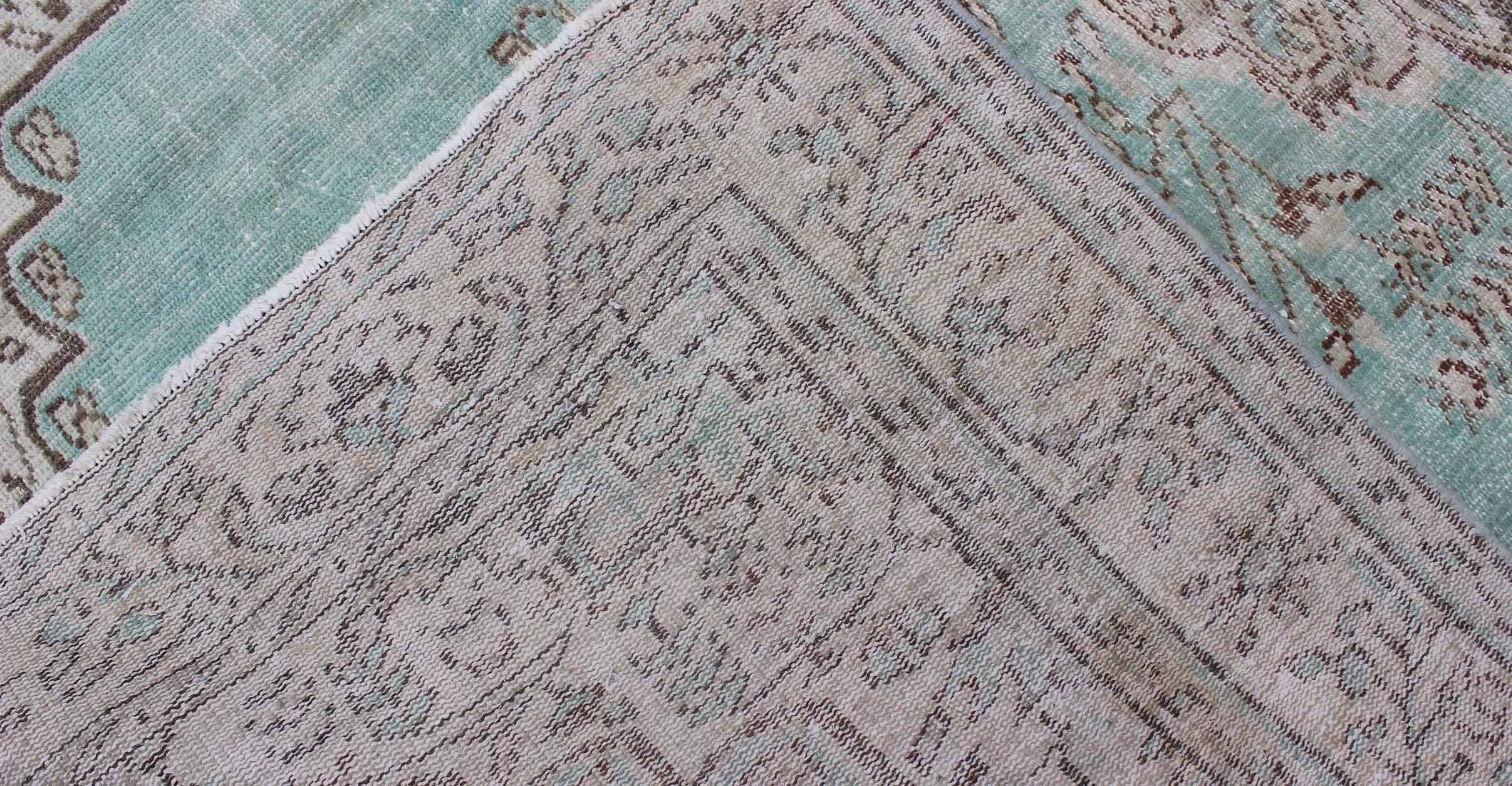 Wool Vintage Oushak Rug with Aqua Color Background and Brown Highlights For Sale