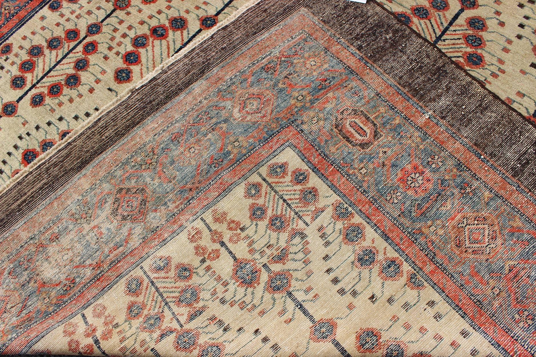 Wool Antique Persian Serab Rug with Tree Design in Cream, Red, Blue and Brown Colors For Sale
