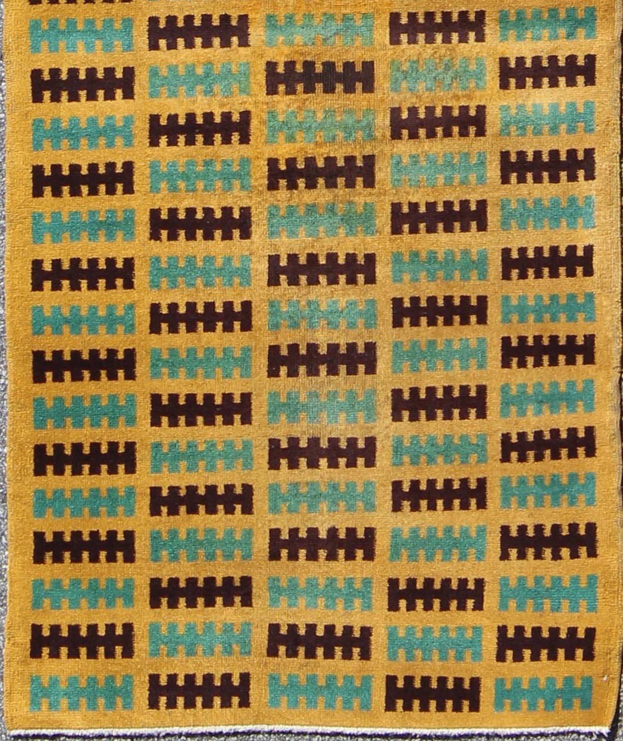 Mid-Century Modern Turkish Runner in Gold, Black and Teal Blue.
Famous Turkish artist, Zeki Müren, designed a group of neo-Baroque-styled award-winning rugs and carpets. Deriving inspiration from both Zeki Müren’s creative imagination and the Art