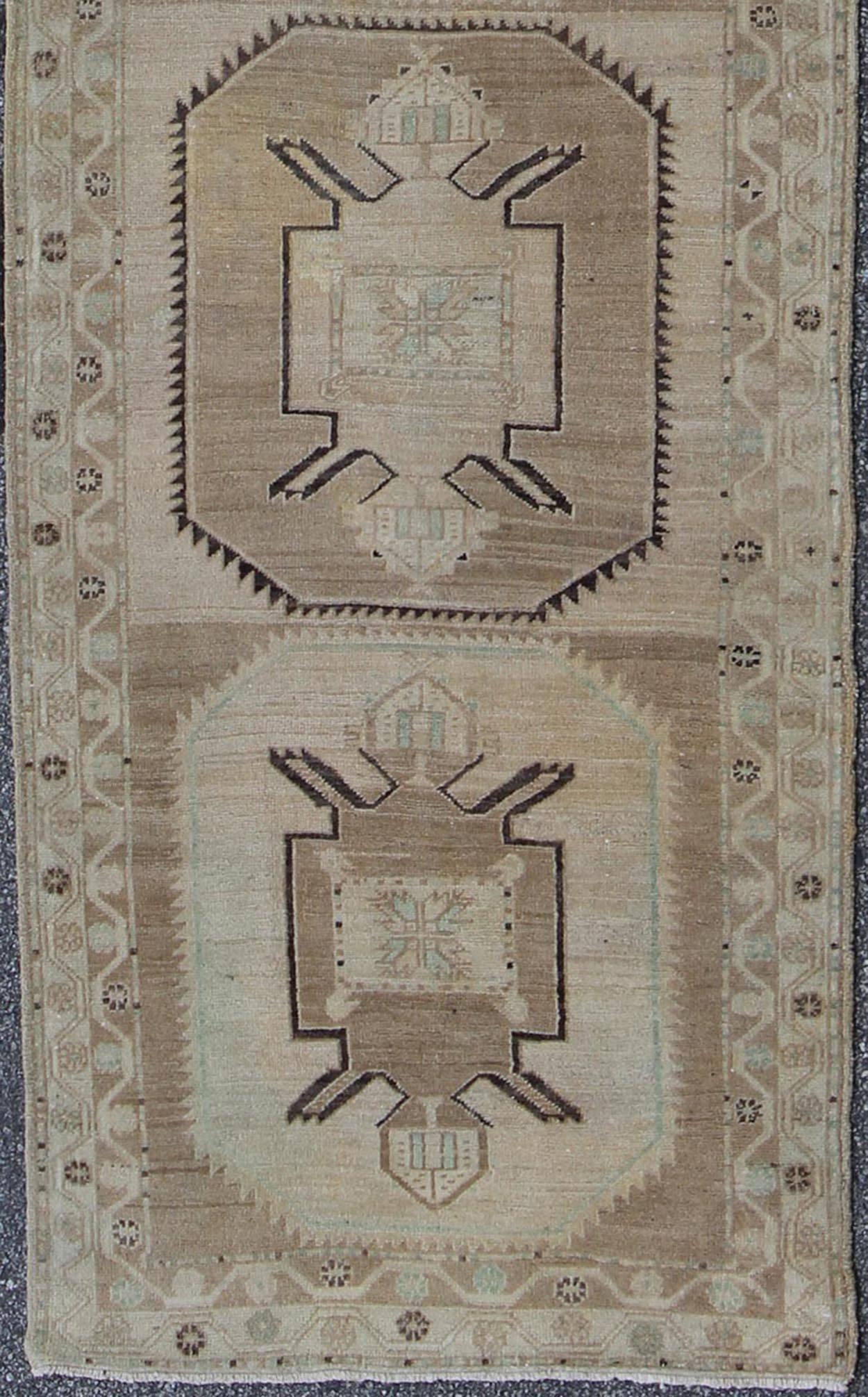 Oushak Runner with Geometric Design in Neutral Colors.
This compelling and unique Oushak runner was made in the middle years of the 20th century in Turkey. Characterized by a comely and highly representative Oushak composition, this carpet