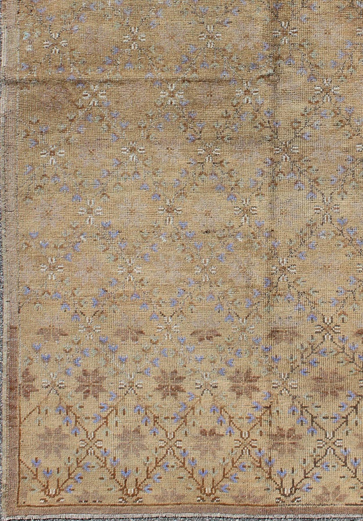 Outstanding floral patterns replenish the field in this wonderful Oushak. The various shades of light blue and periwinkle are sprinkled across the light mocha and camel color background to form a magnificent blend of warm colors.

Measures: 4'10'' x