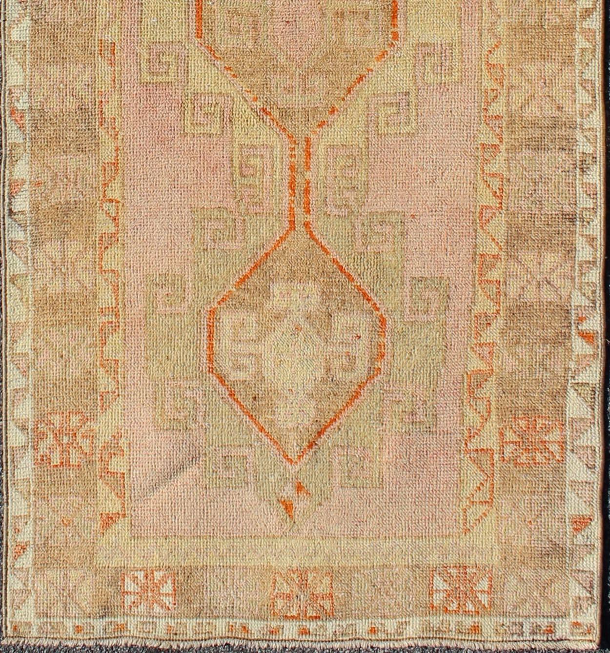 Measures: 3'2 x 9'1.
Handwoven in Turkey, this unique Oushak runner features four medallions surrounded by Greek key motif. Unique in coloration, this gorgeous runner features colors such as coral, pink, orange, light green, camel and taupe.