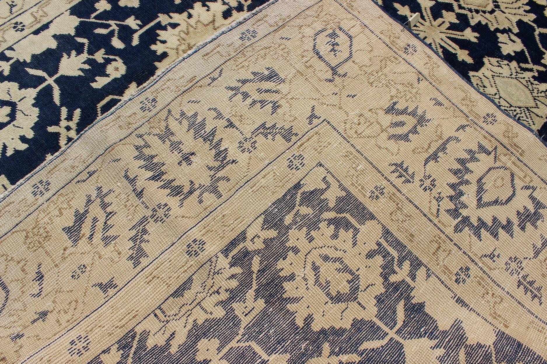 Wool Unique Turkish Oushak Rug with Floral Design in Dark Blue, Cream and Light Brown For Sale