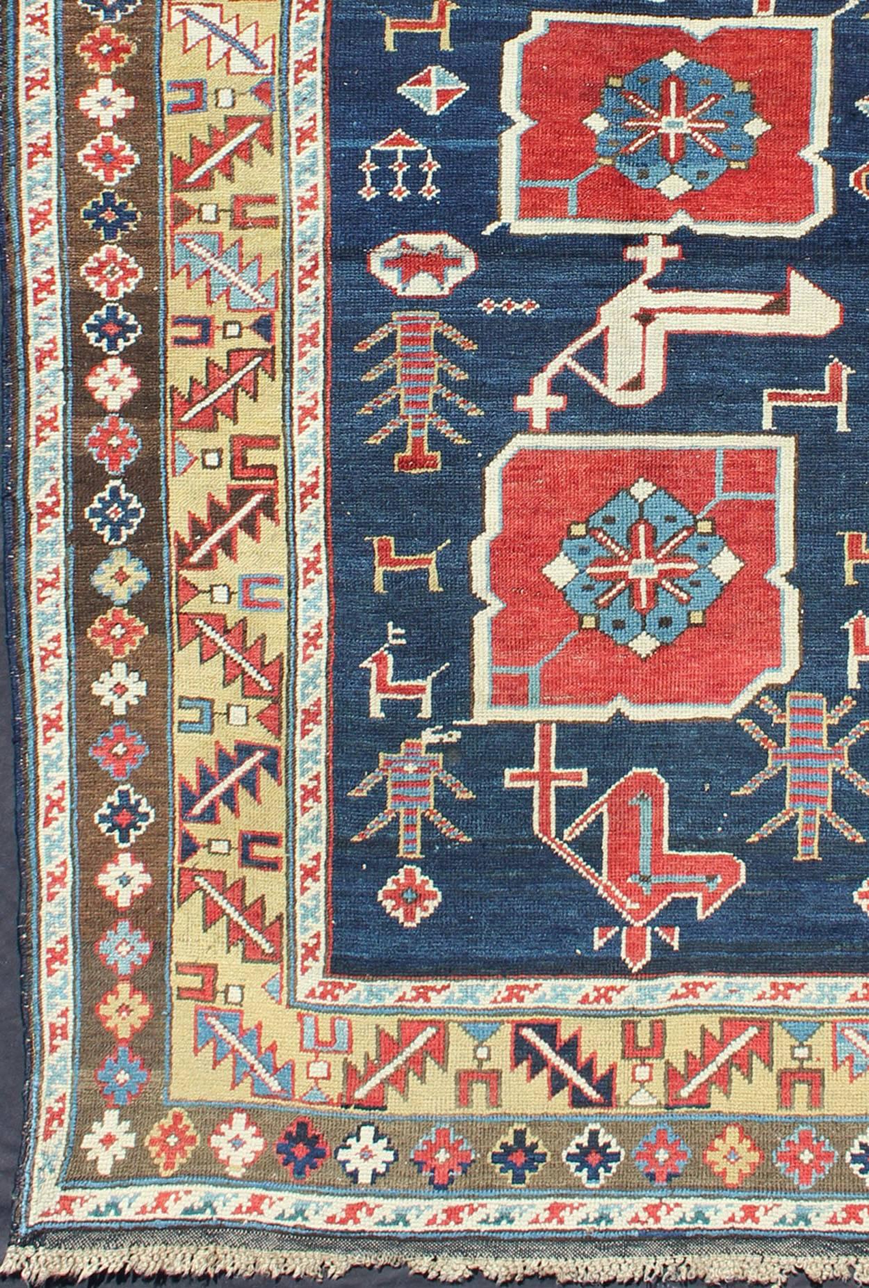 Antique Caucasian Karaqashli Rug in Blue Background and Yellow Border.
Woven in the Kuba district of the northeast Caucasus Mountain, this Karagashli features a distinctive combination of bold geometry enhanced by a beautifully saturated color