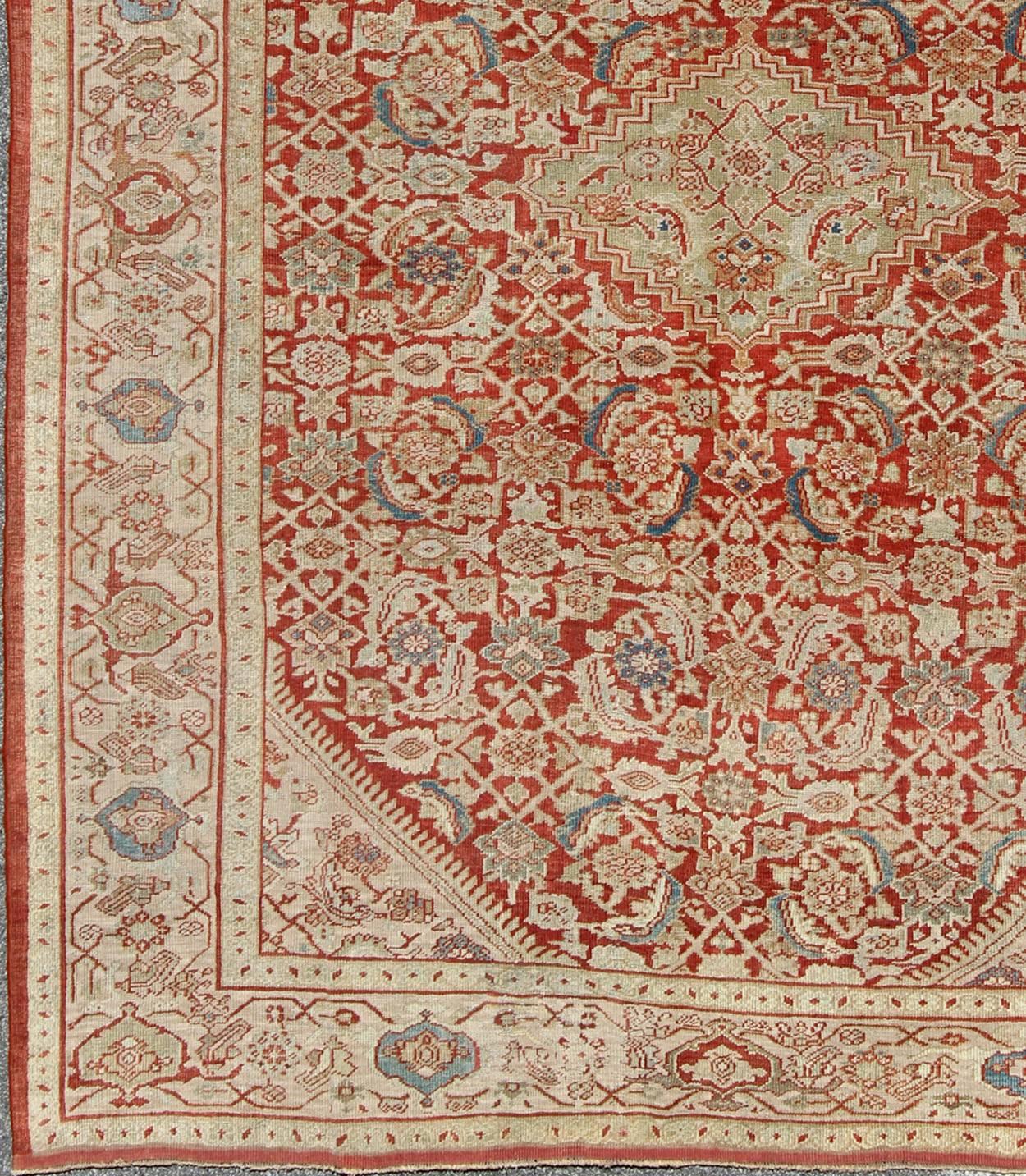 Antique Persian Sultanabad rug with Herati design in red, green, blue and cream, Keivan Woven Arts / rug / F-0910. Antique Persian Sultanabad.

This antique Persian rug is a reinvention of traditional Persian pattern adapted for European interiors