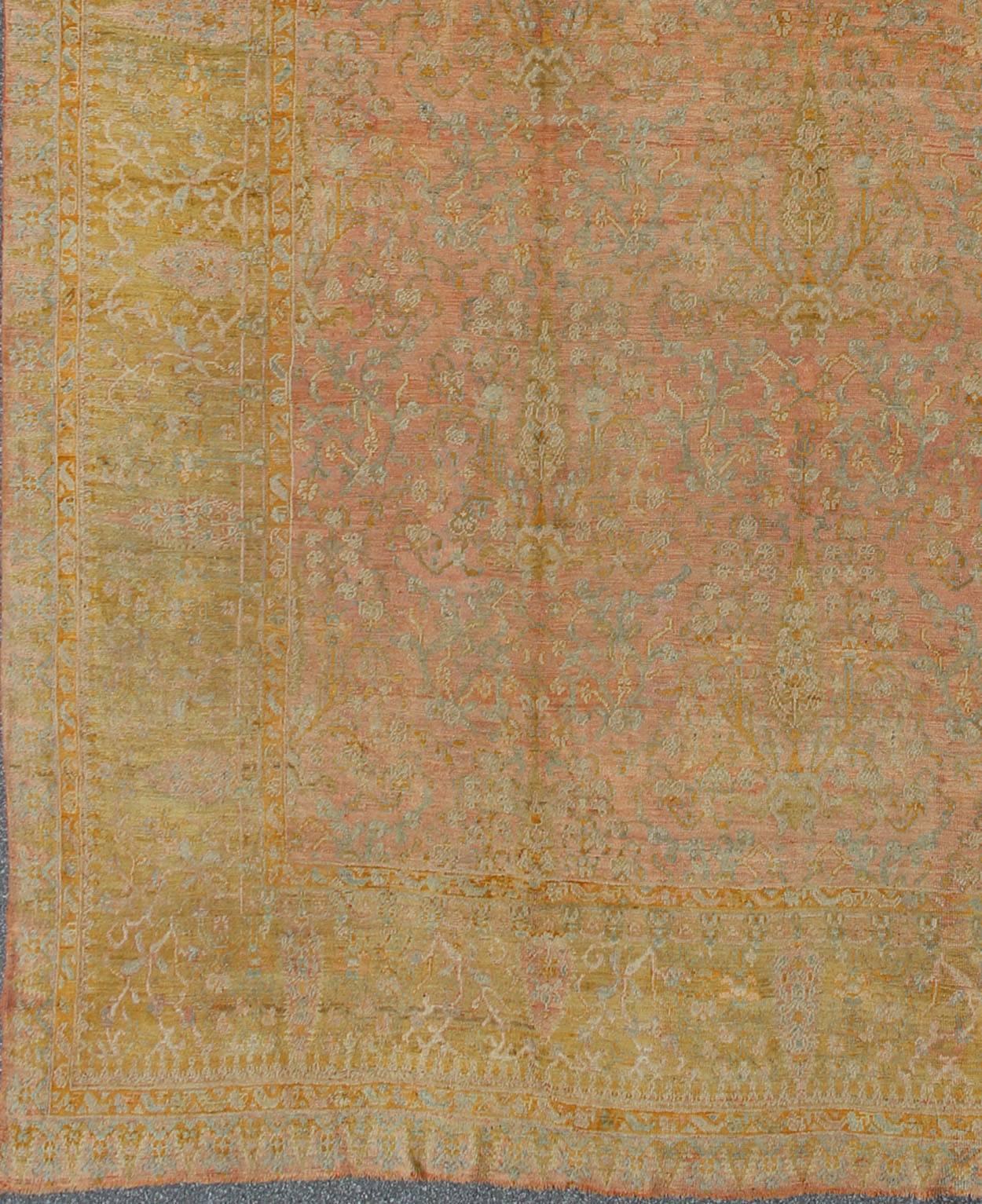 Large antique Turkish Oushak rug in pink, light blue and Chartreuse Green, HS-KB-300,
This impressively large muted Oushak carpet from the turn of the century possesses a soft and sophisticated color palette paired with intricate design. The