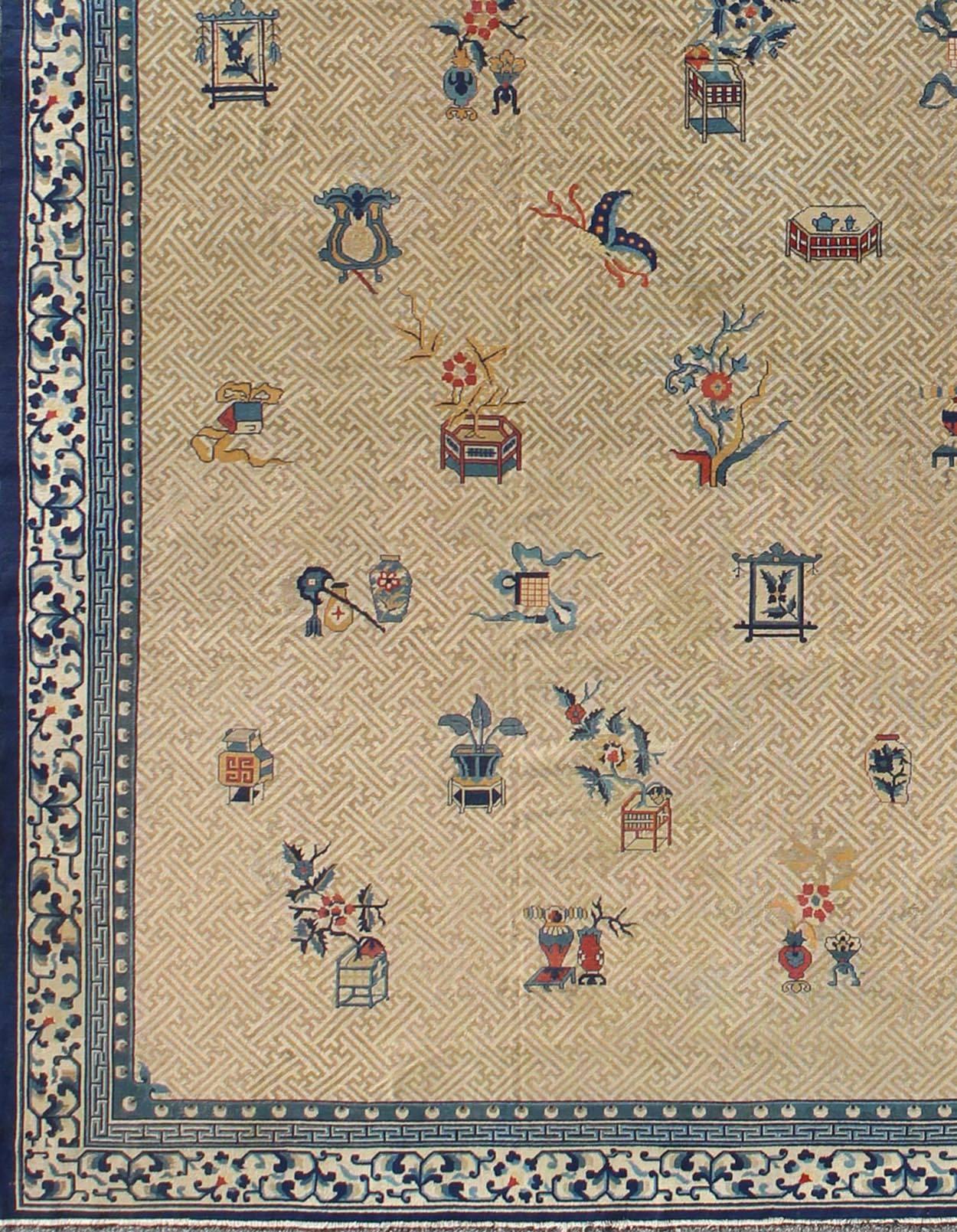 Large Antique Chinese Carpet in Ivory/Taupe Background and Blue Border.
A traditional design incorporating phoenix motifs and Chinese elements distinguishes this Chinese rug from all others. Symbolizing the Emperor and Empress, the dragon and