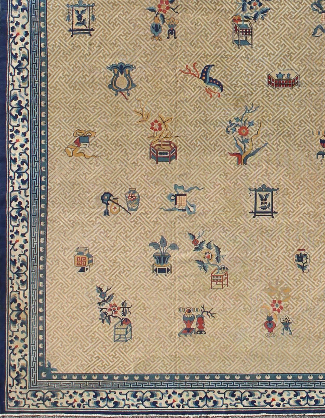 Large Western Chinese Antique Carpet in Ivory/Taupe Background and Blue Border.

Measures: 11'9 x 16'2

A unlikely design, this mid 19th century rug was woven in western China also referred to as Indo Chinese.  This rug displays a unique design that