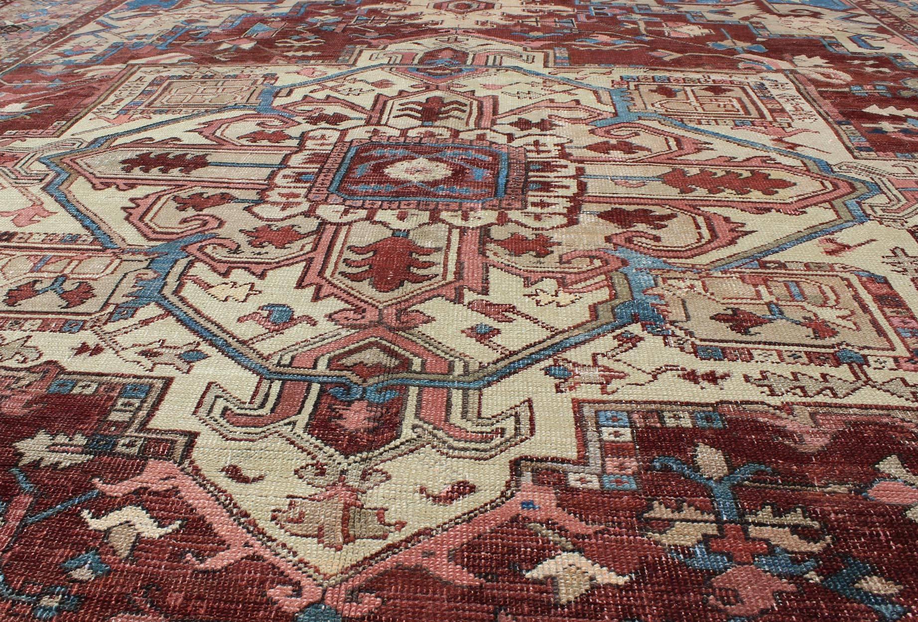 Wool Antique Persian Serapi Carpet With Medallion In Reddish Brown Tan and Light Blue For Sale