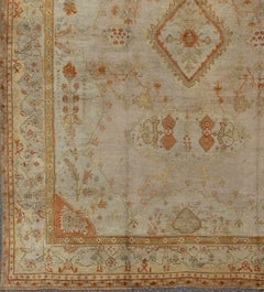 Antique Turkish Oushak Rug in green, Yellow, blush, apricot and light blue